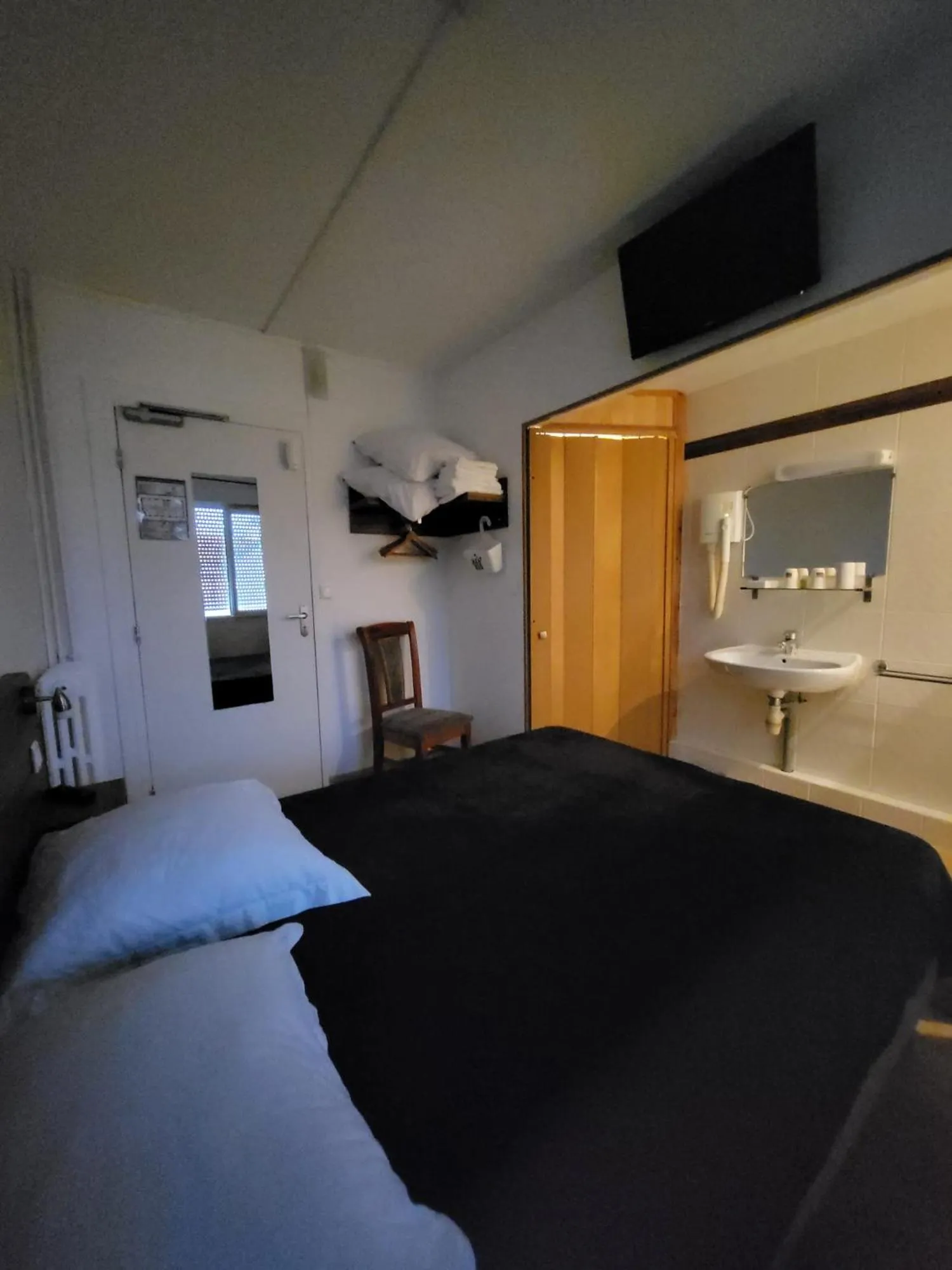 Bedroom in Hotel Les Rosiers