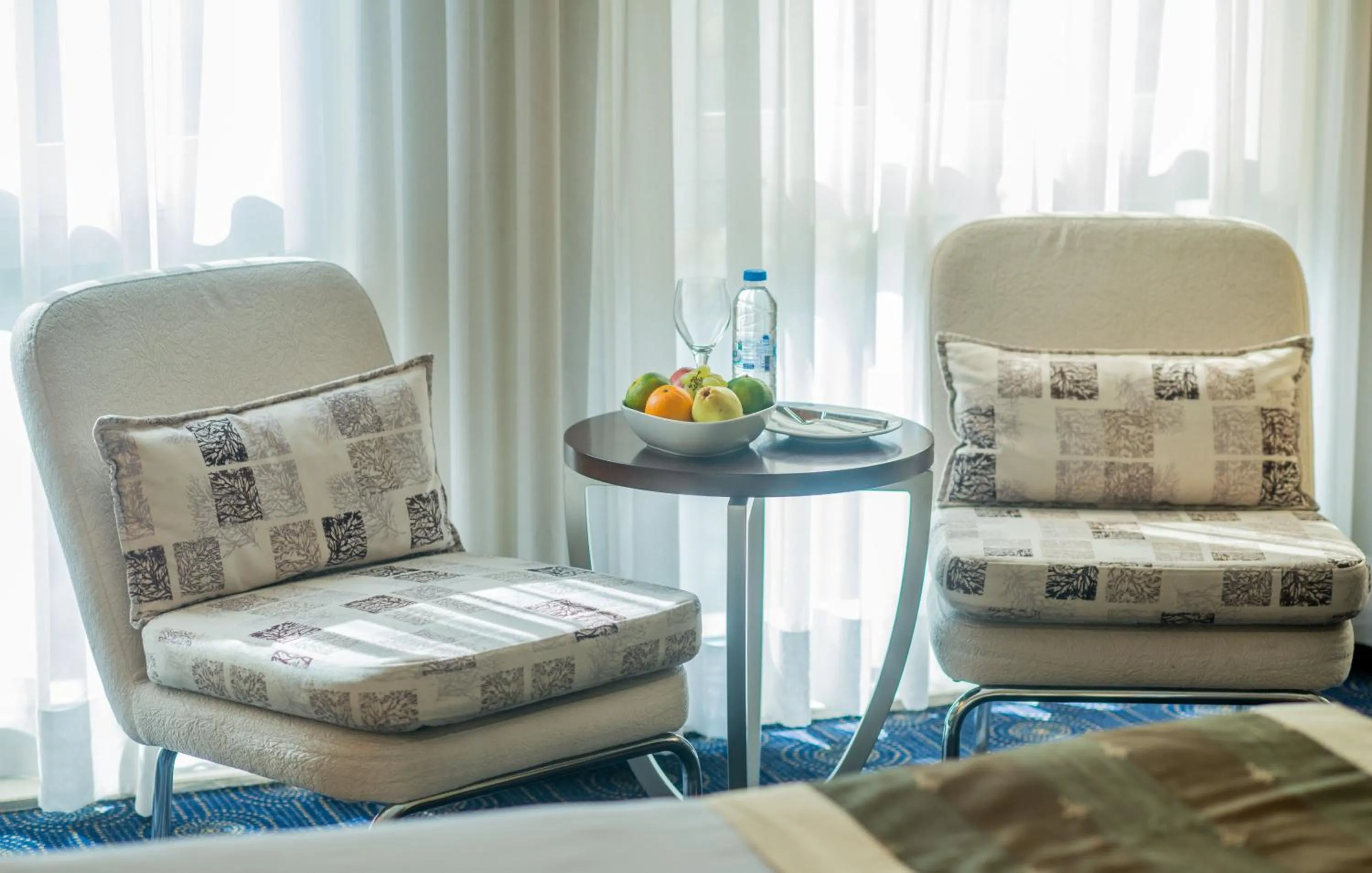 Seating area in CK Farabi Hotel