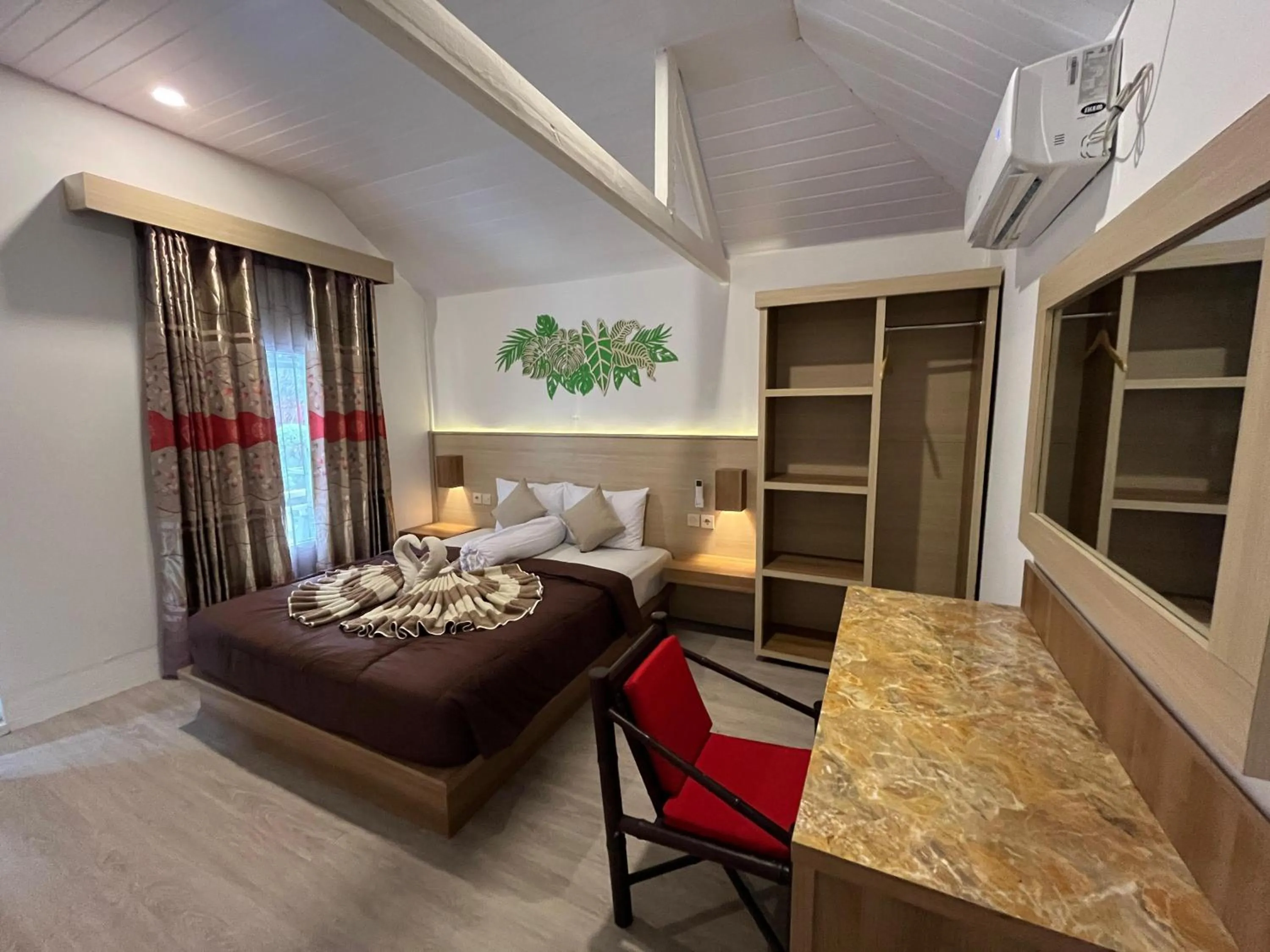 Seating area, Bed in Coral Beach Seaside