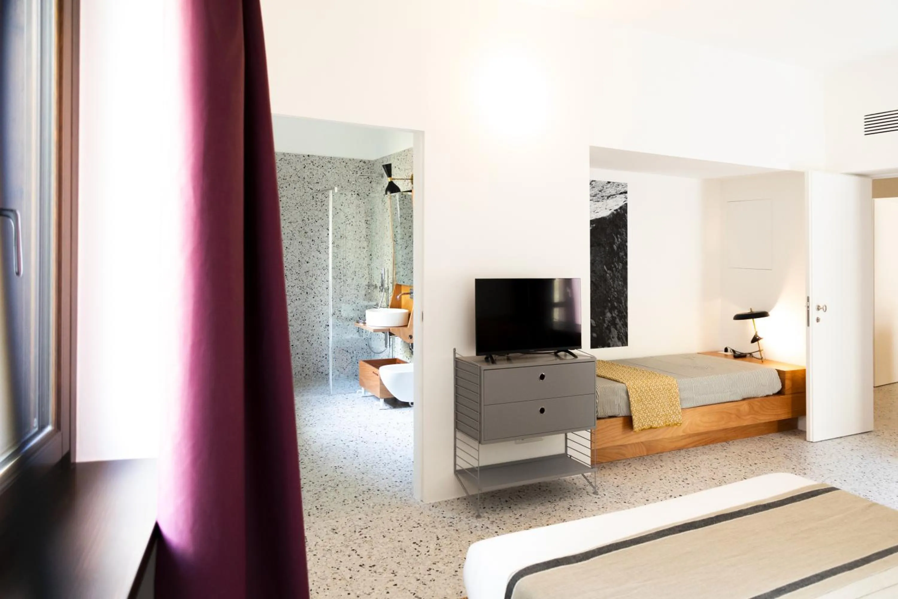 Bed in Hotel Dolomiti