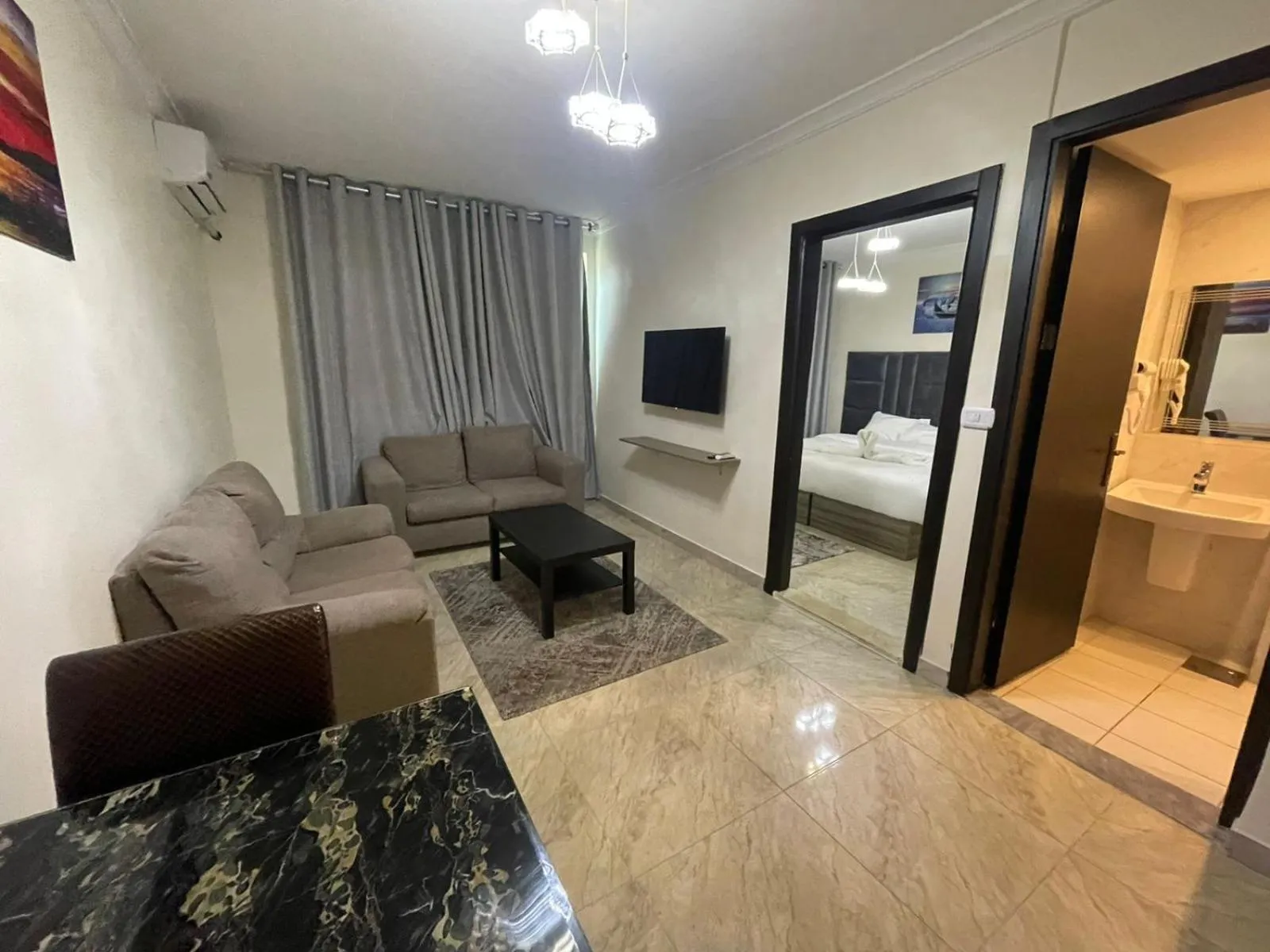 Communal lounge/ TV room, Bed in Golden Hotel