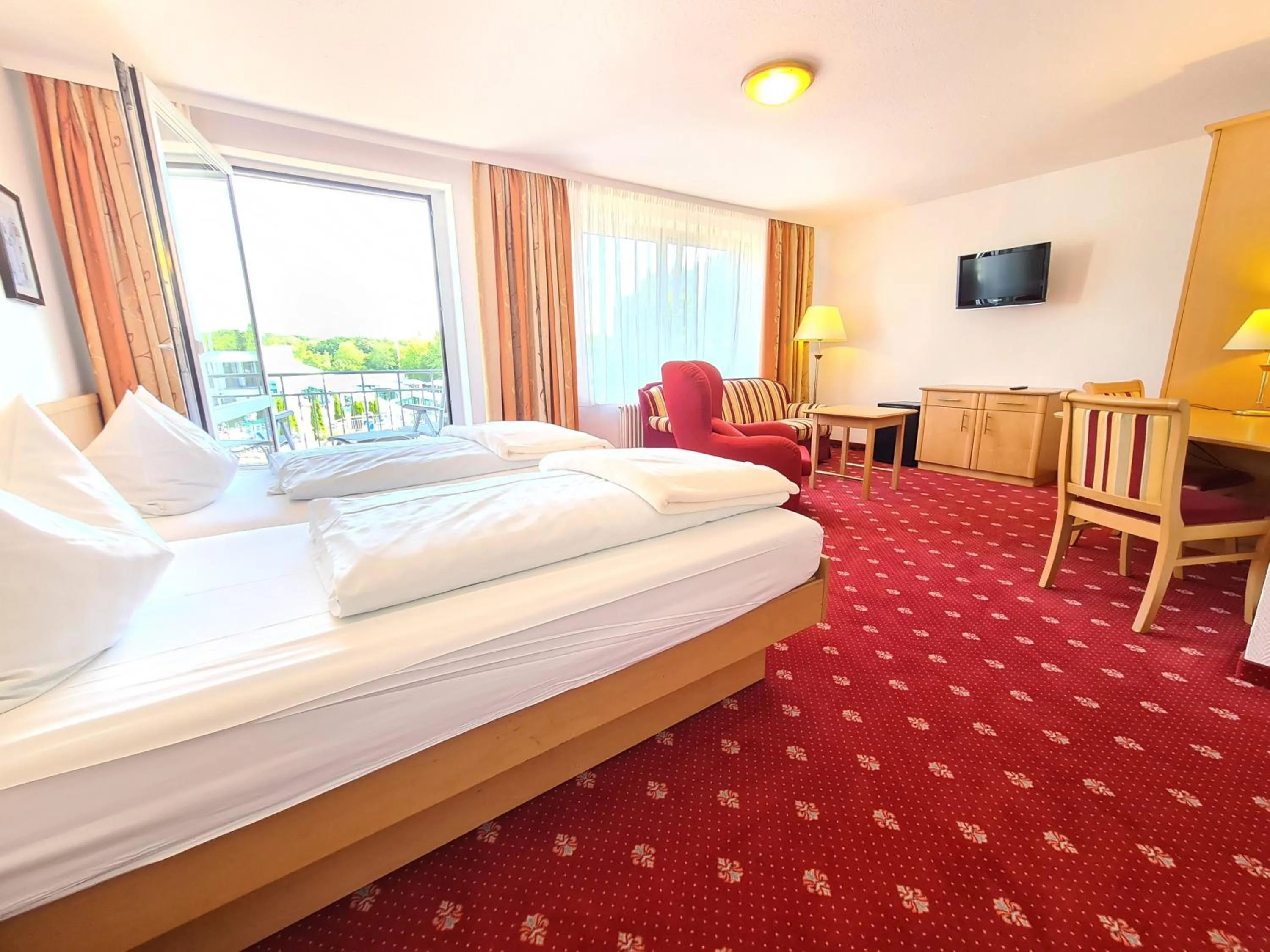 Photo of the whole room, Bed in Thermenhotel Tannenhof - Ihr Wohlfühl-Hotel