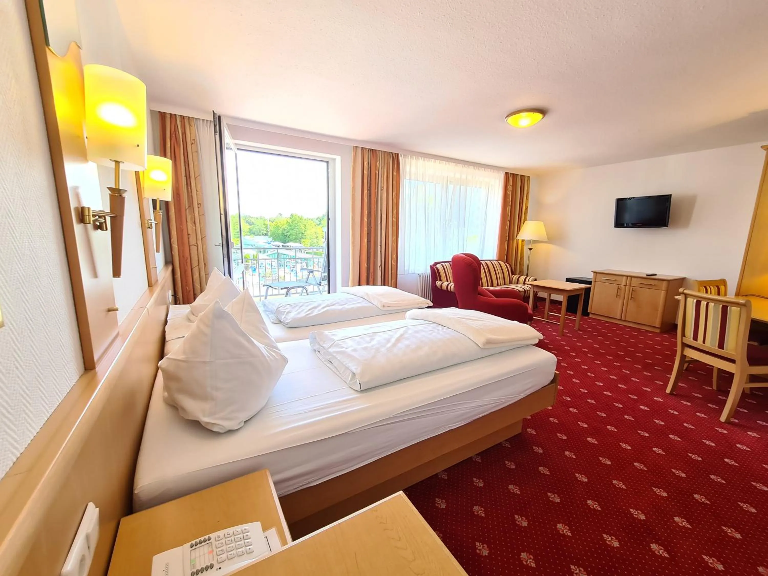 Photo of the whole room, Bed in Thermenhotel Tannenhof - Ihr Wohlfühl-Hotel