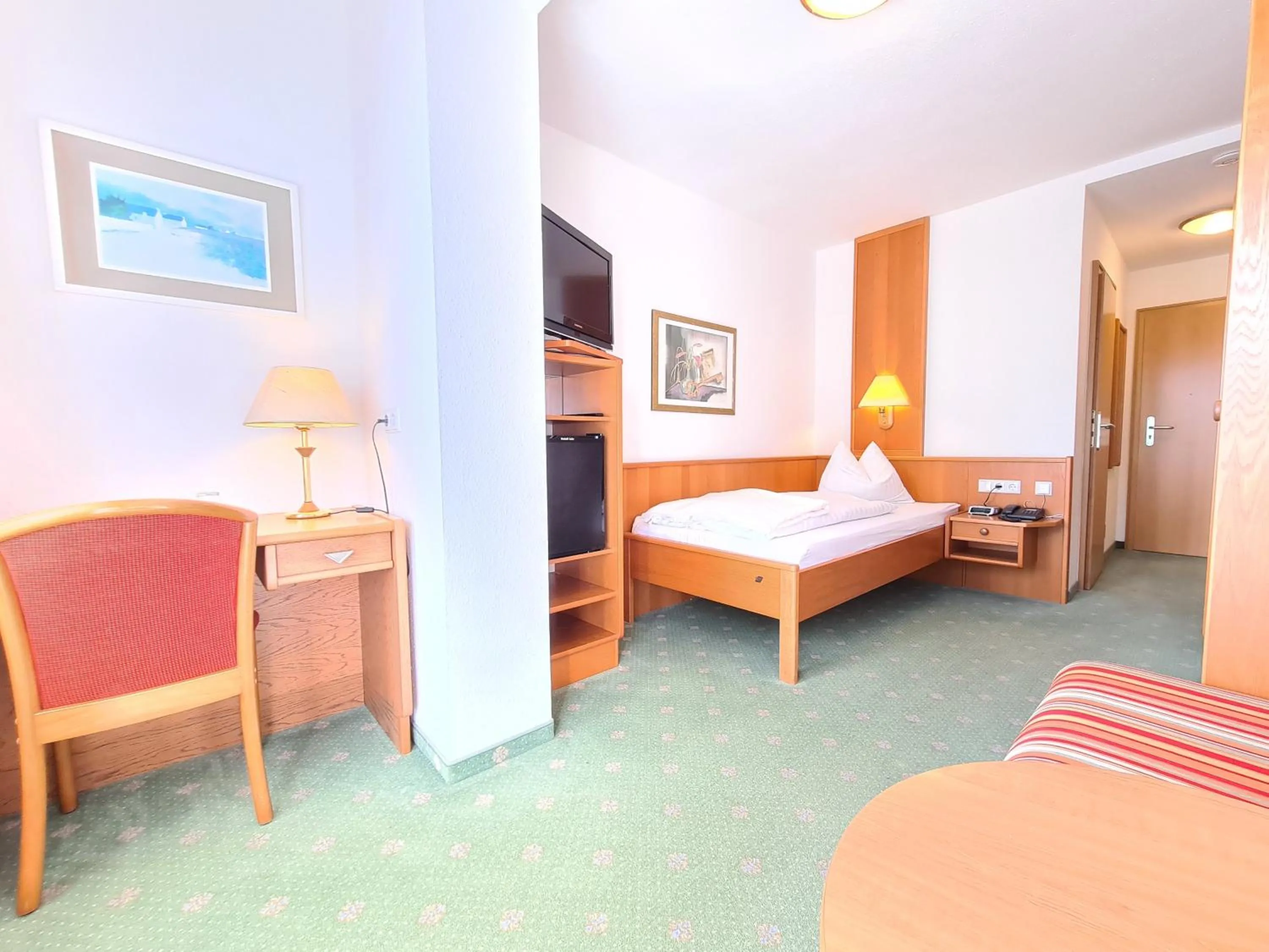 Photo of the whole room, Bed in Thermenhotel Tannenhof - Ihr Wohlfühl-Hotel