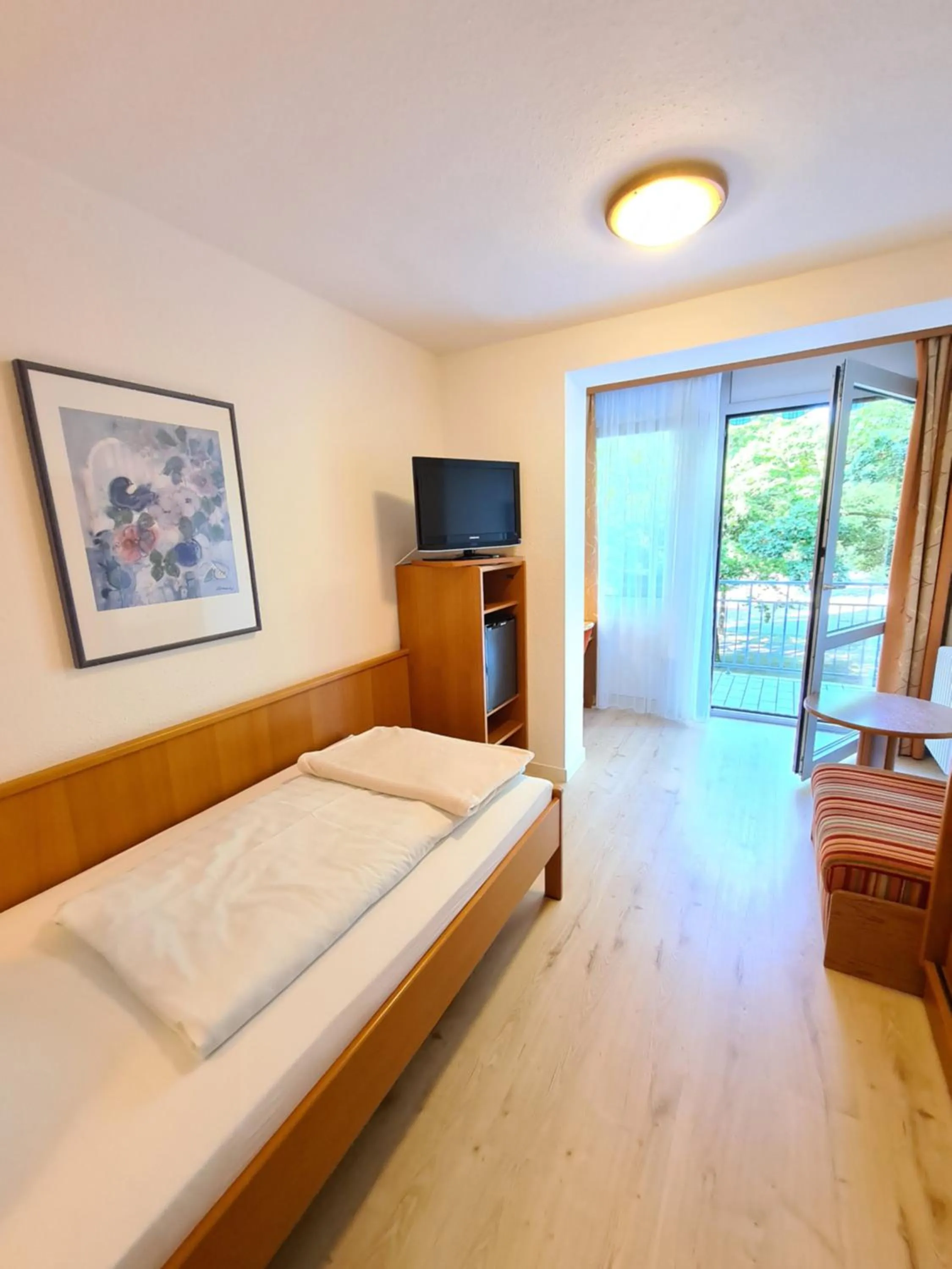 Photo of the whole room, Bed in Thermenhotel Tannenhof - Ihr Wohlfühl-Hotel