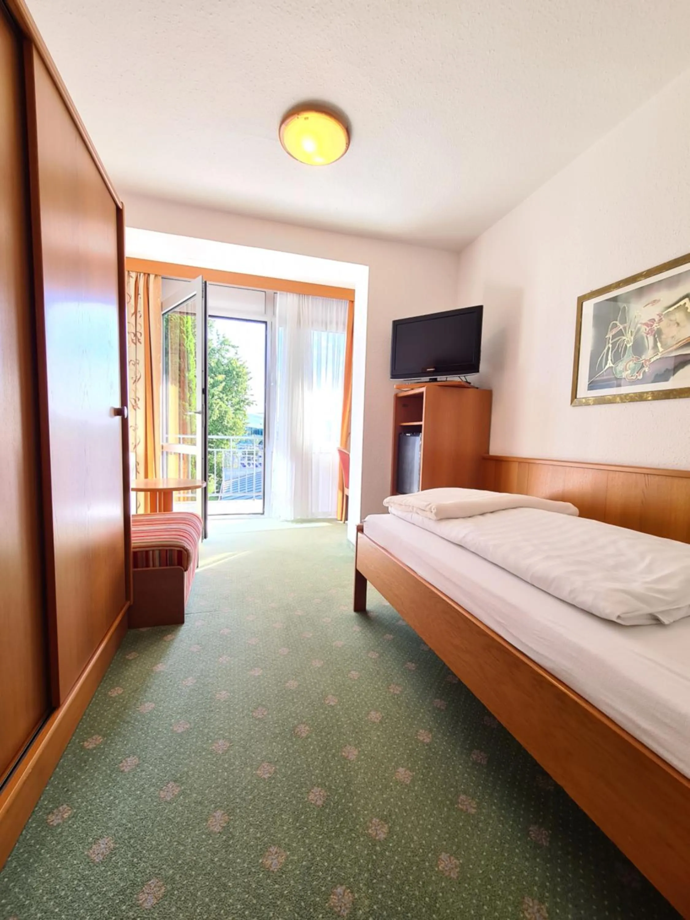 Photo of the whole room, Bed in Thermenhotel Tannenhof - Ihr Wohlfühl-Hotel