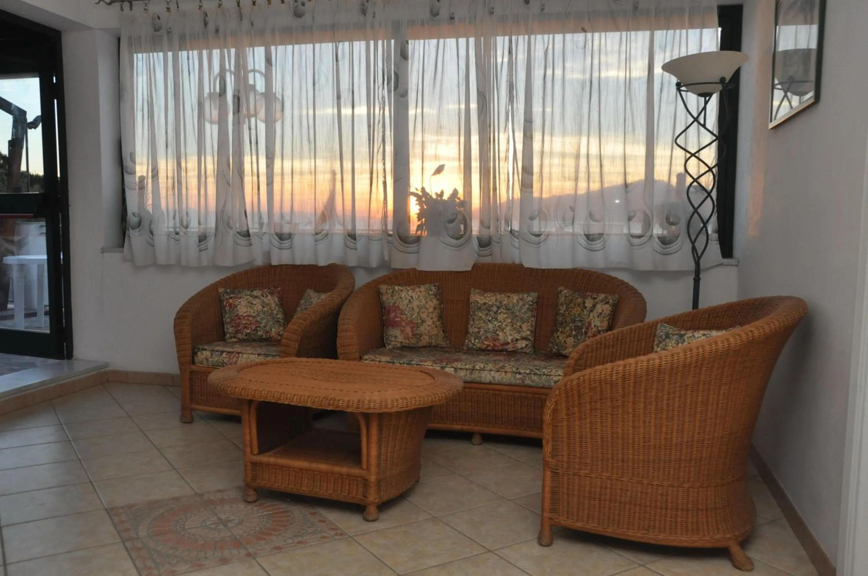 Communal lounge/ TV room in Appartamenti Villa Miramare