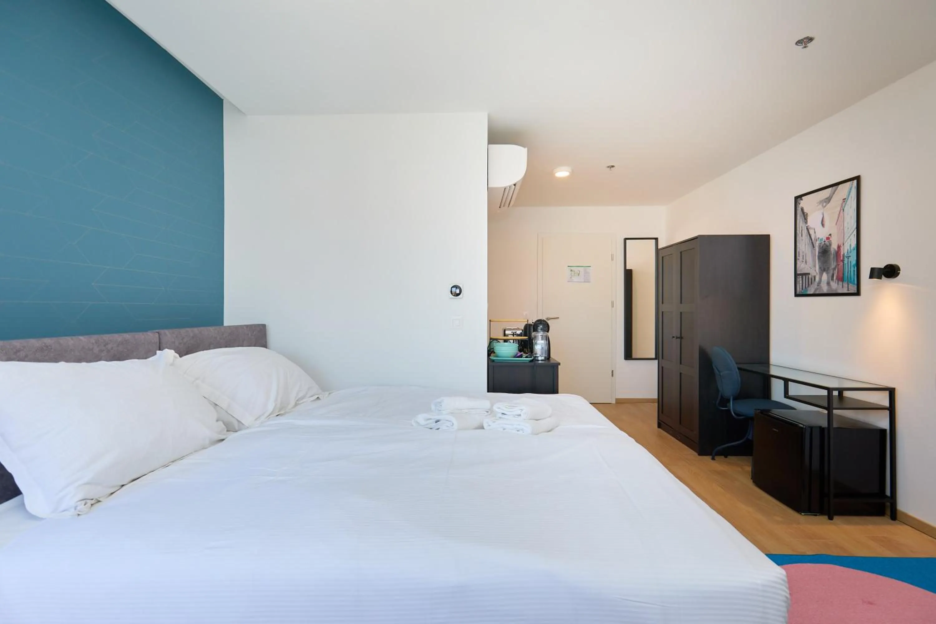 Bed in DOMINIUM CITY SUITES