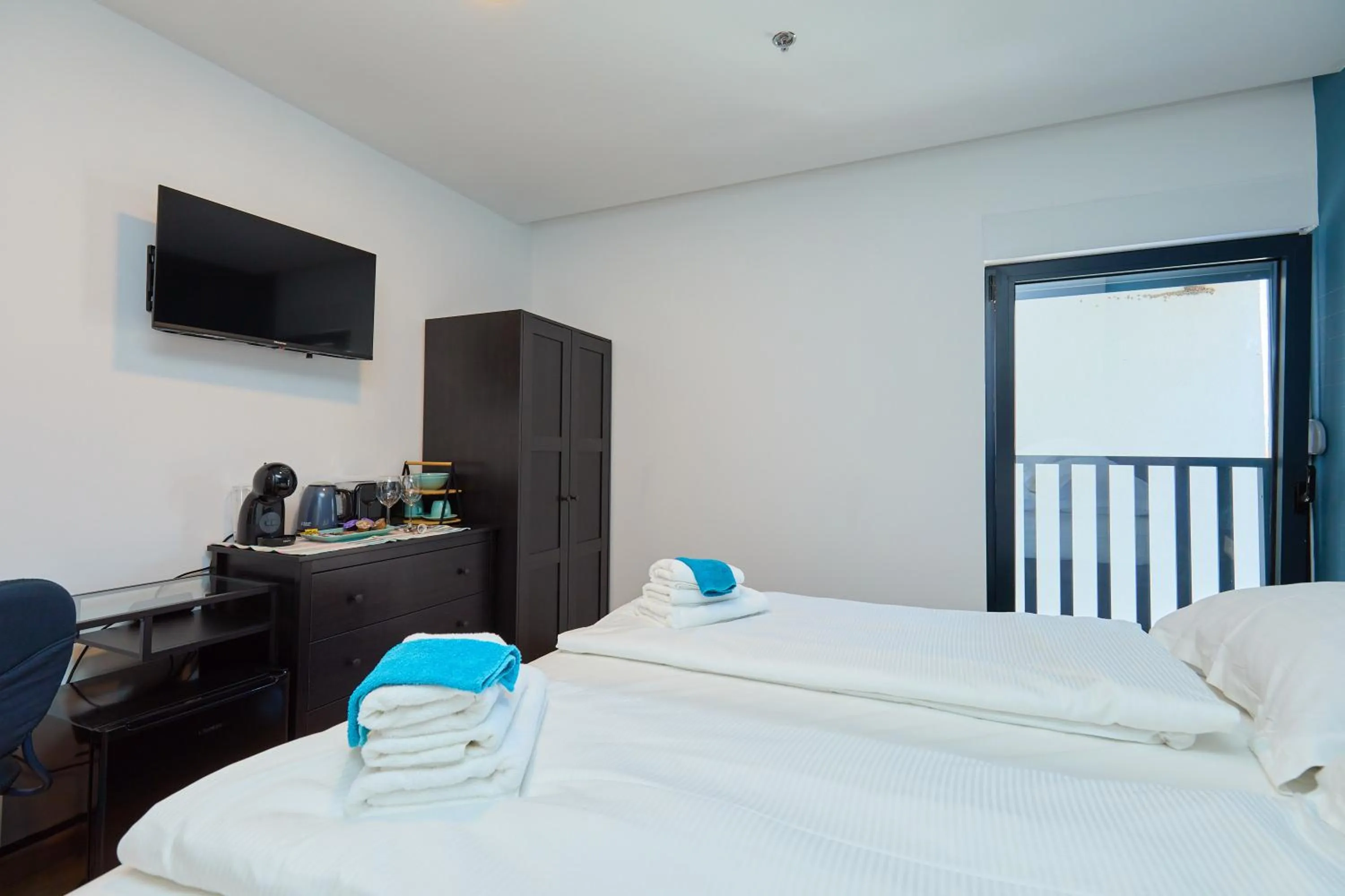 Bed in DOMINIUM CITY SUITES