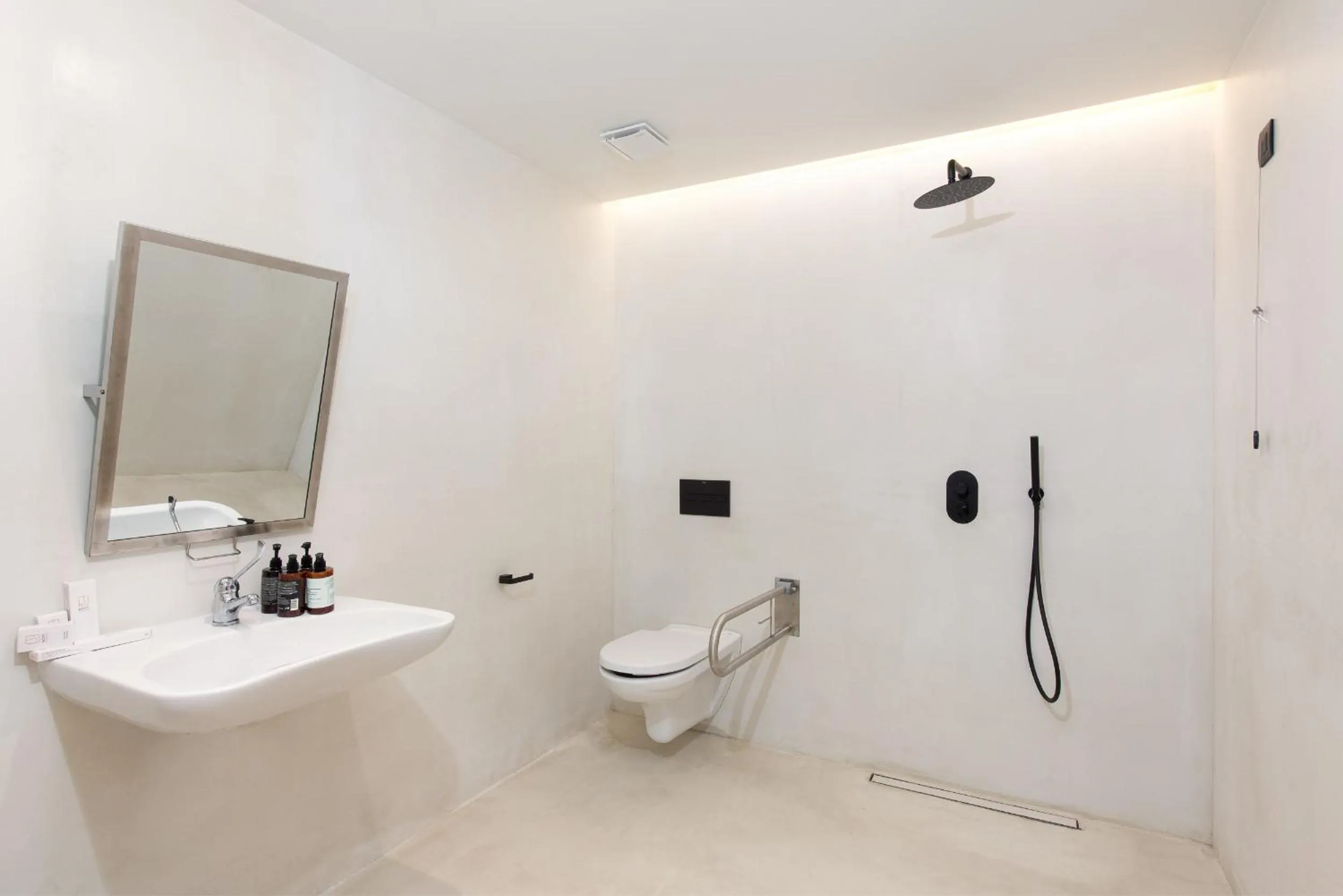 Shower in KOIA All - Suite Well Being Resort - Adults Only