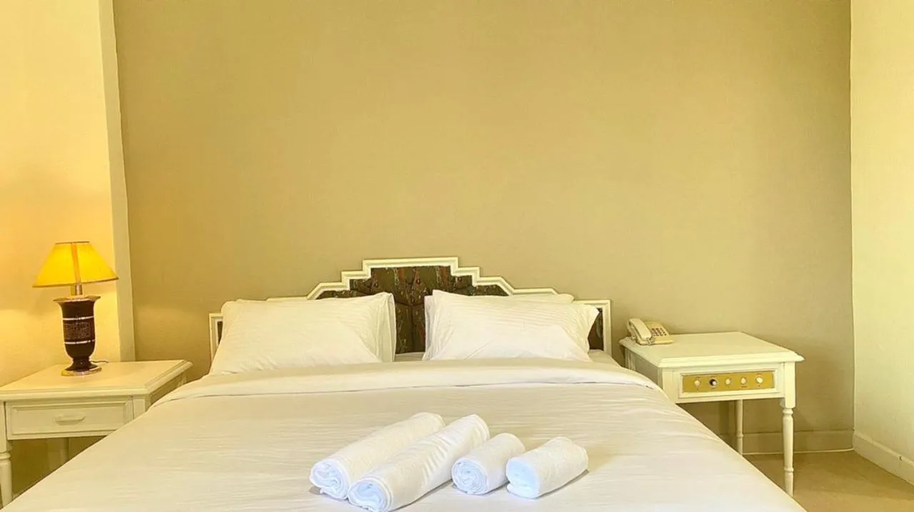 Bed in SWISS AVENUE HOTEL