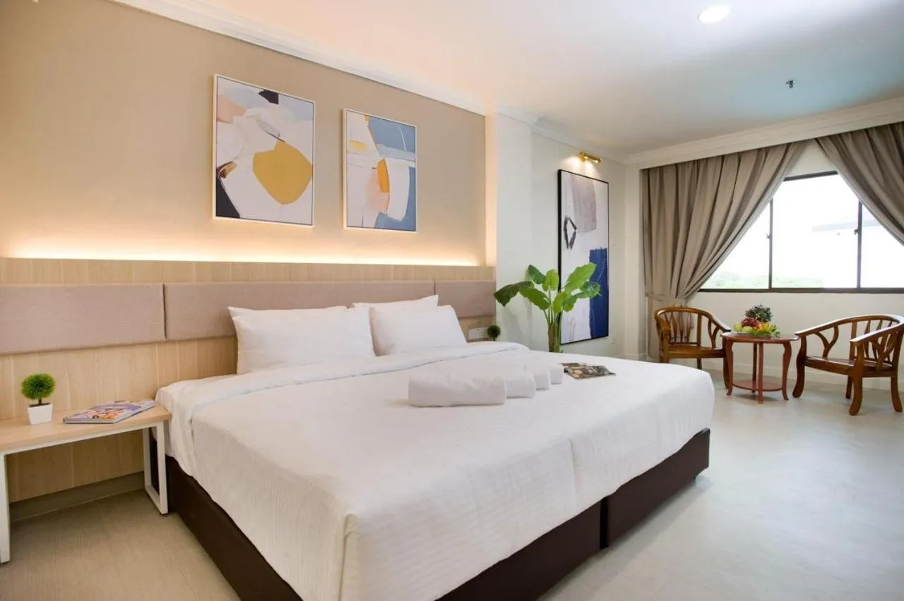 Bed in SWISS AVENUE HOTEL