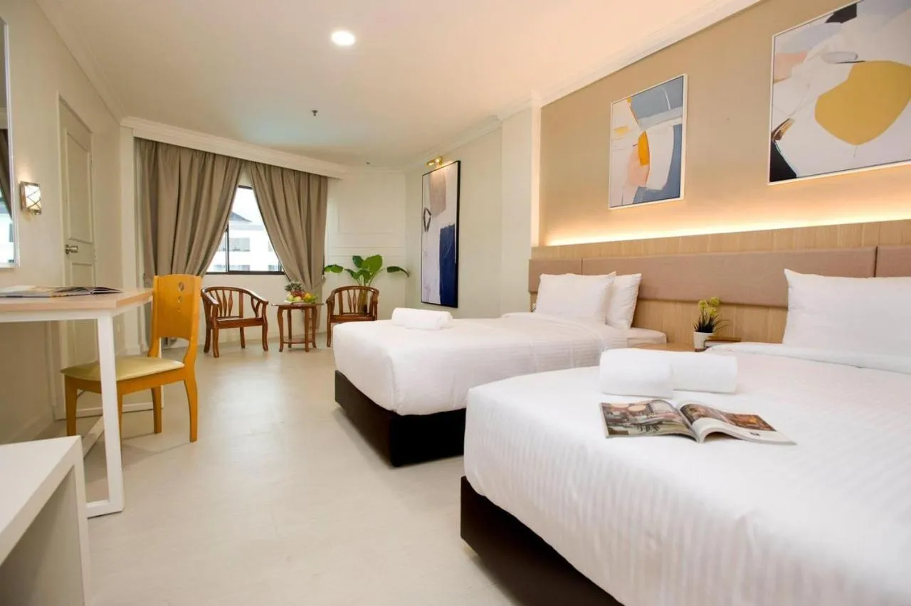 Bed in SWISS AVENUE HOTEL