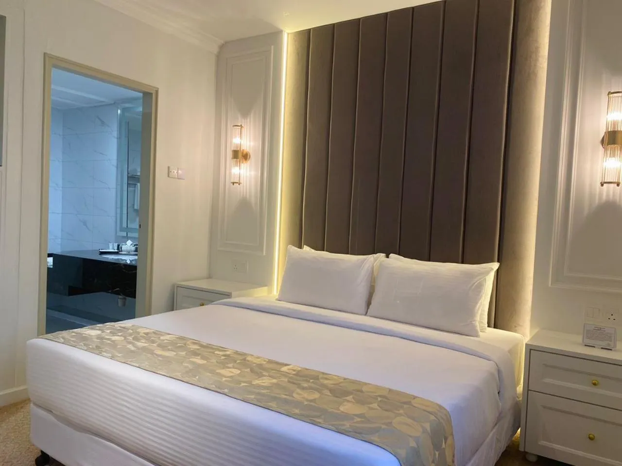 Bed in SWISS AVENUE HOTEL