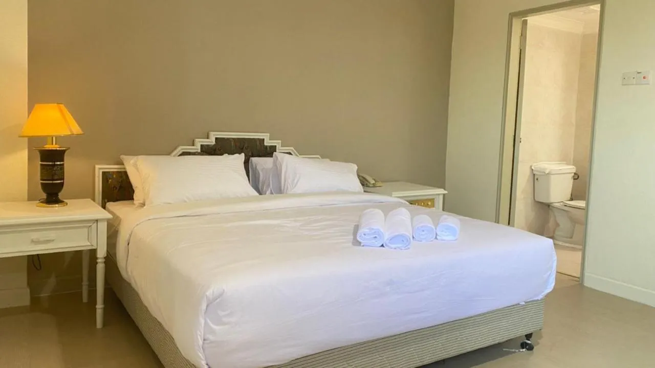 Bed in SWISS AVENUE HOTEL