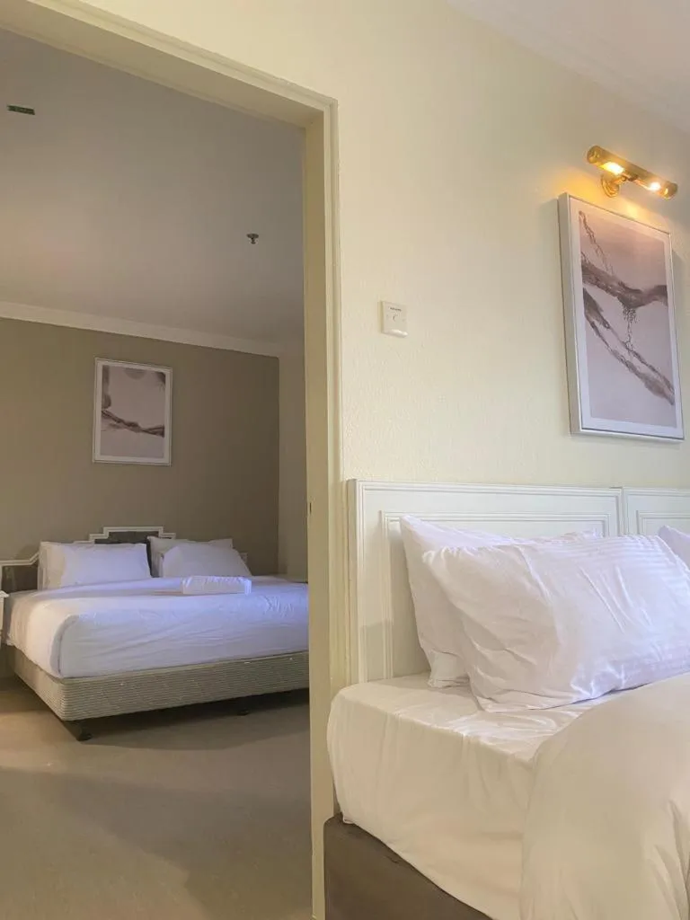 Bed in SWISS AVENUE HOTEL