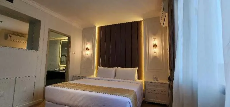 Bed in SWISS AVENUE HOTEL