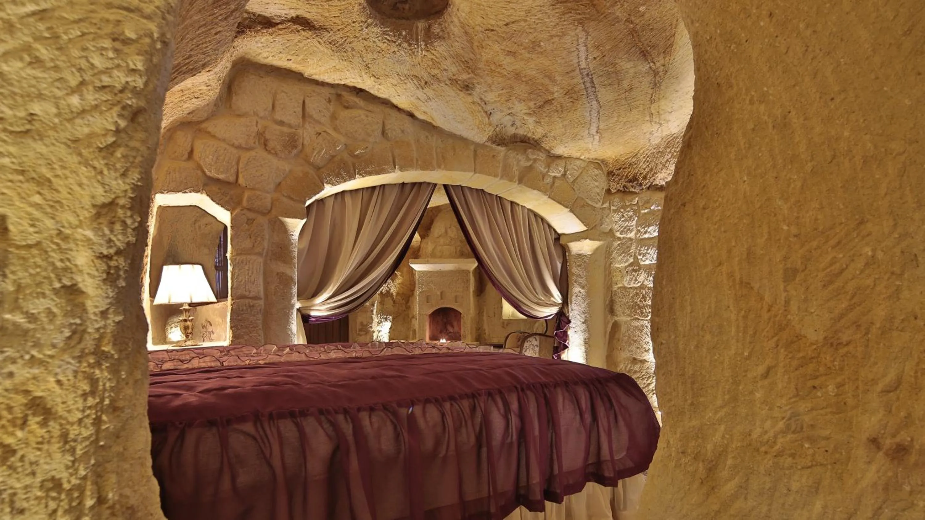 Living room, Bed in Golden Cave Suites