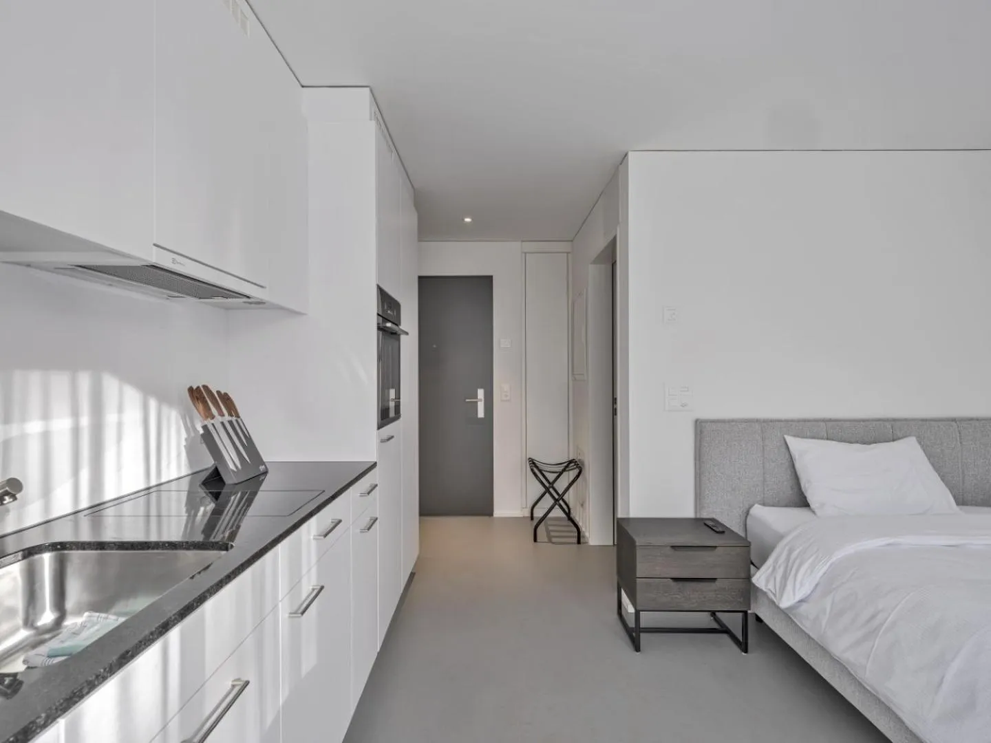 Kitchen or kitchenette, Bed in MOOI Apartments Grenchen