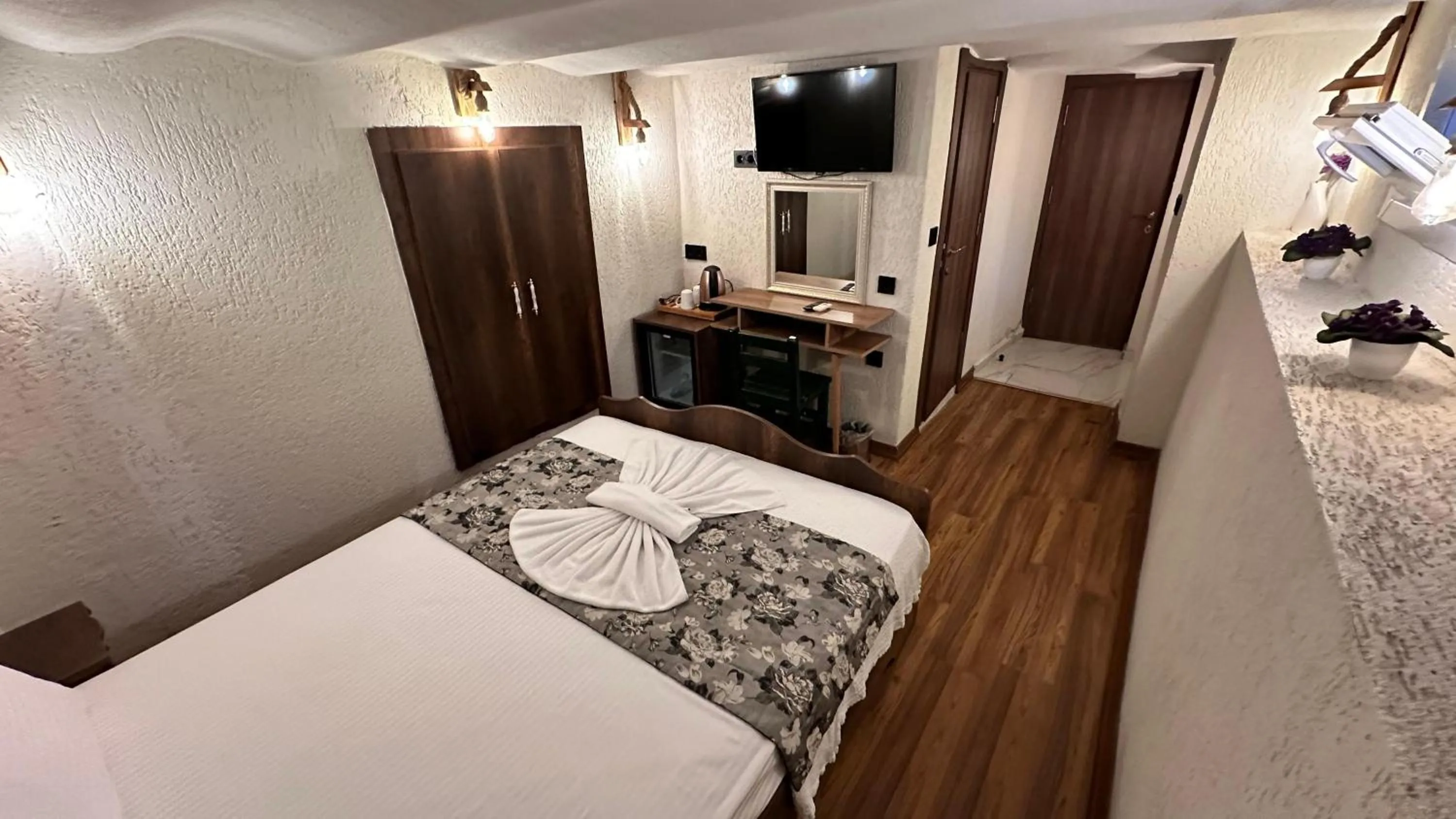 Bed in Aras Boutique Hotel & Suites