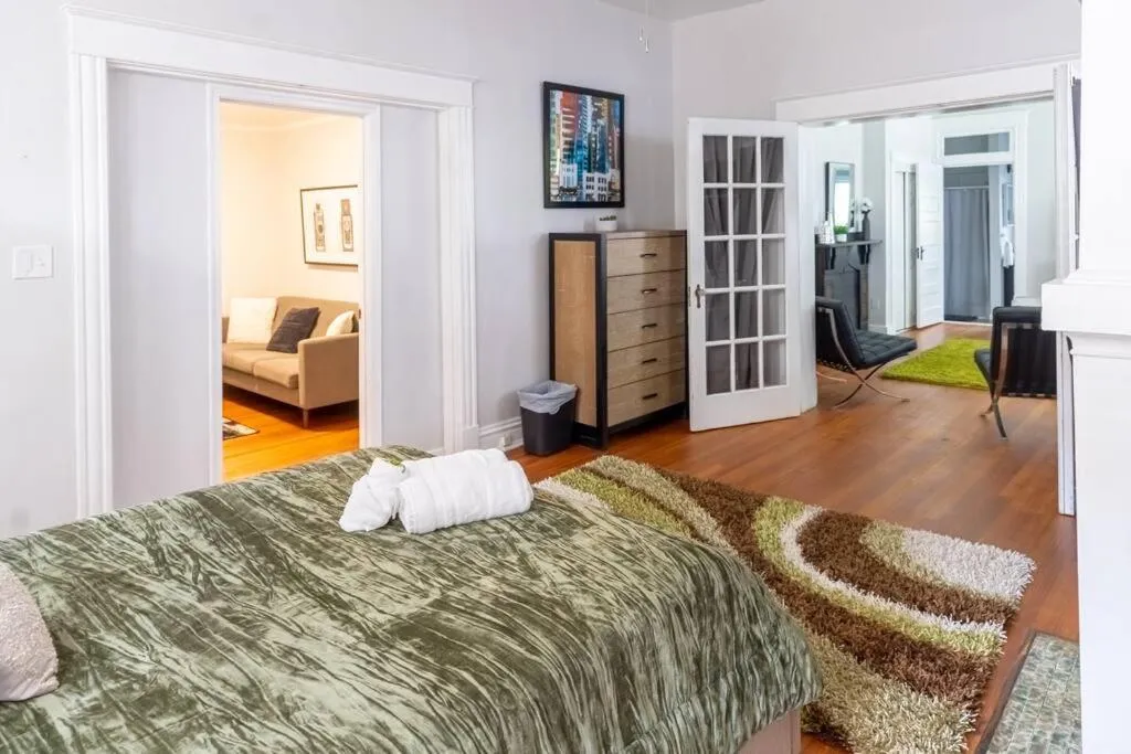 Bed in The Great Pink Lady with Huge Wrap Around Porch!