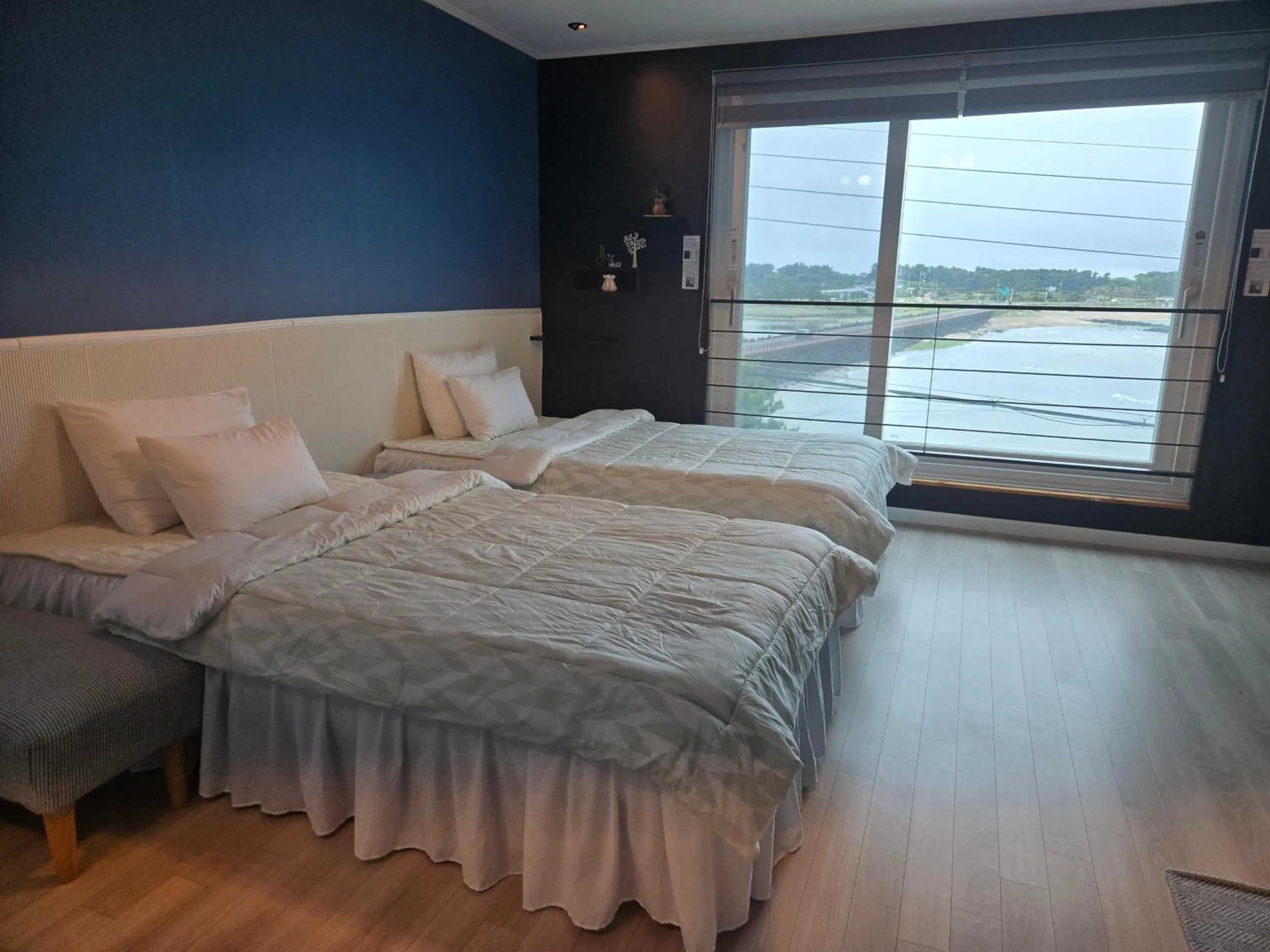 Bed in Jeju Gaviota Pension