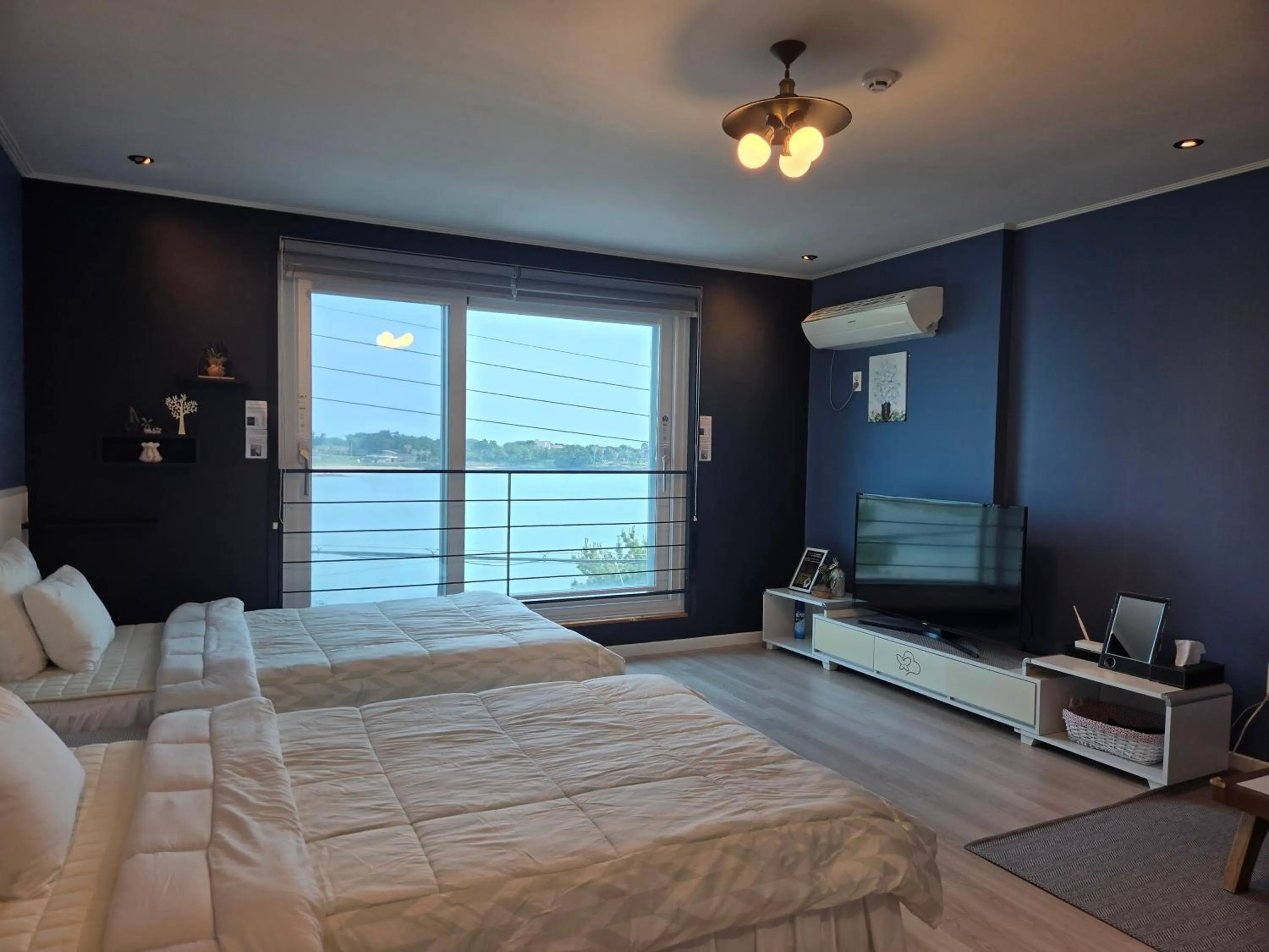 Bed in Jeju Gaviota Pension