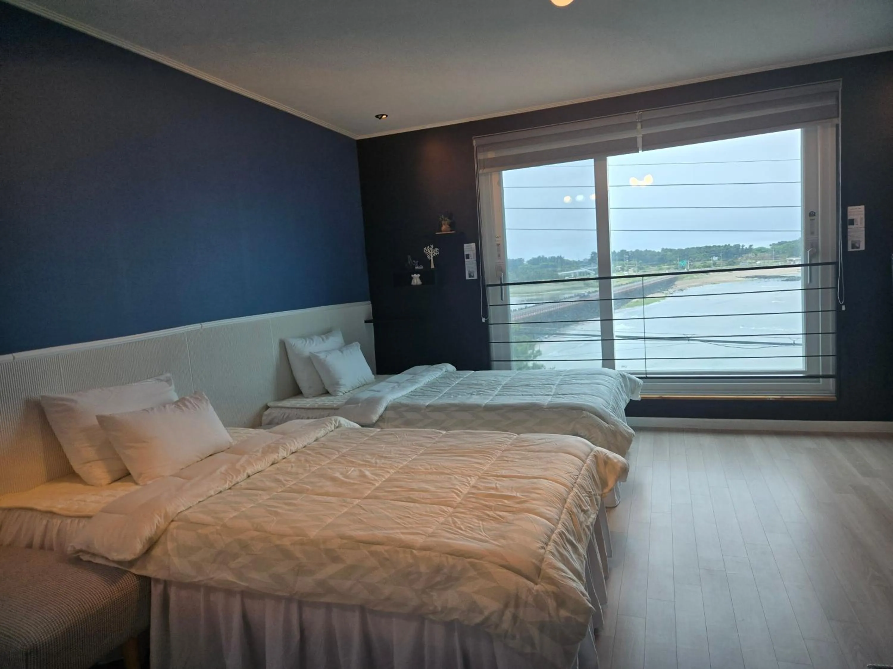 Bed in Jeju Gaviota Pension