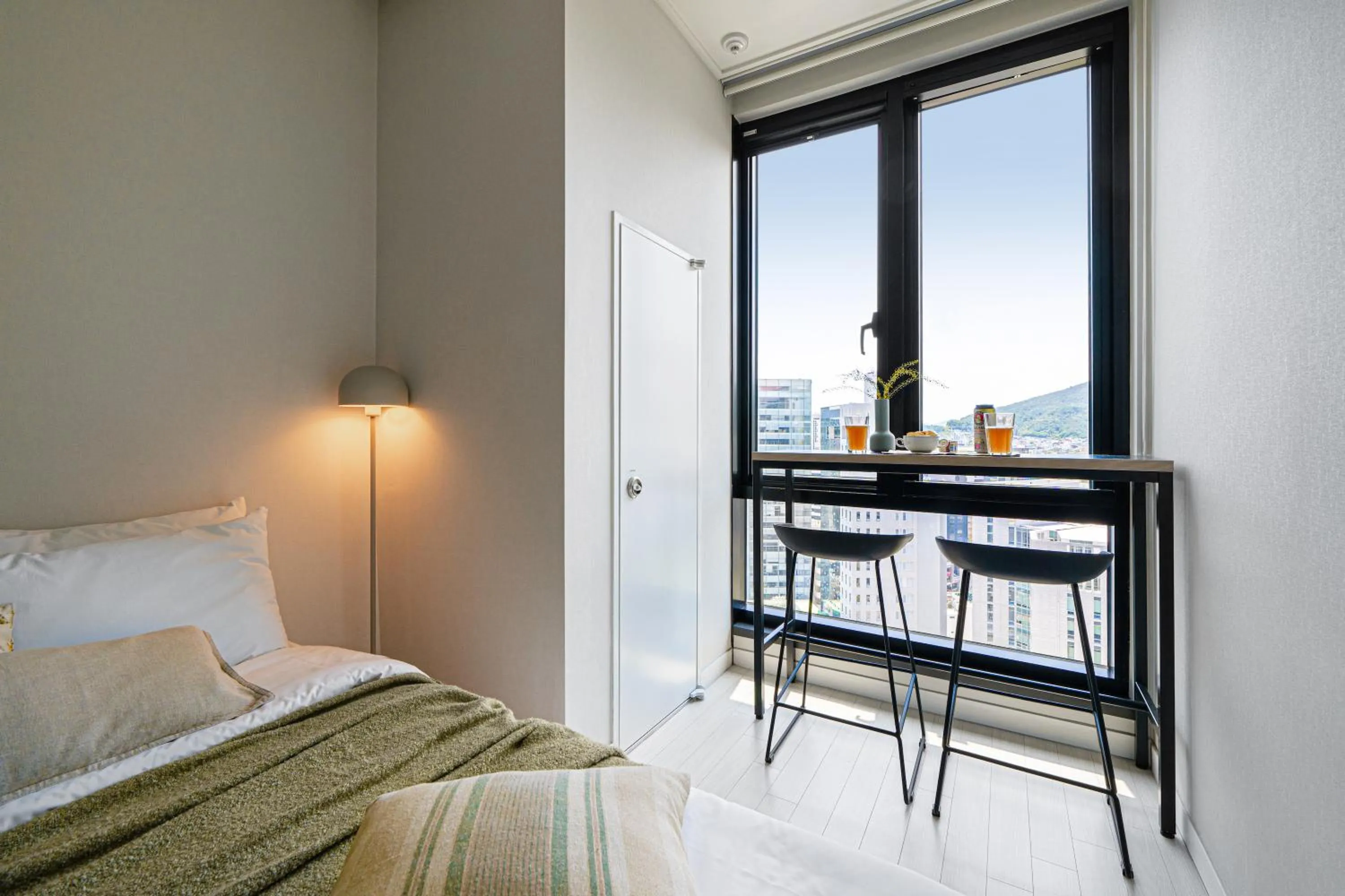 Seating area, Bed in Urbanstay Seomyeon