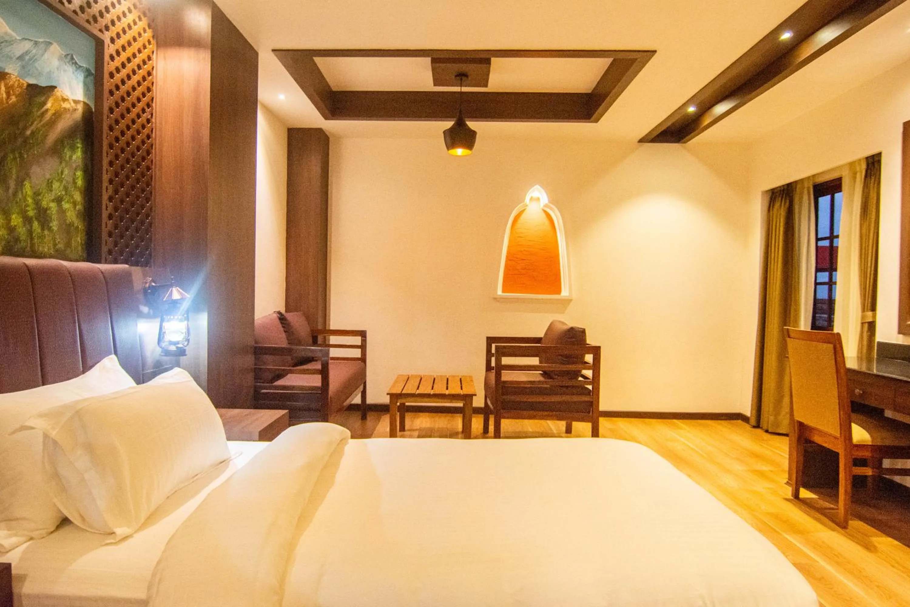 Seating area, Bed in Everest Boutique Hotel