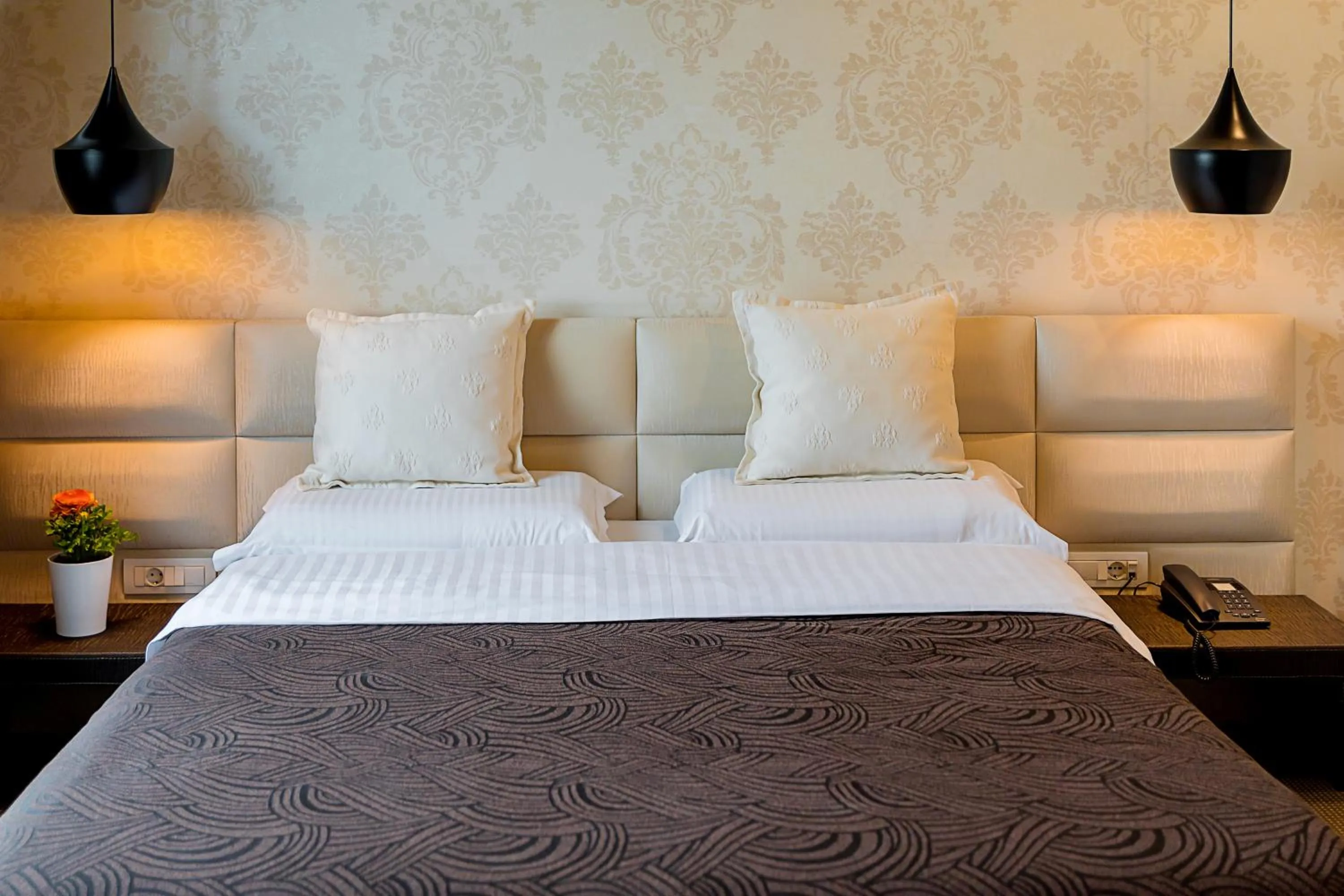 Bed in La Bohème Hotel