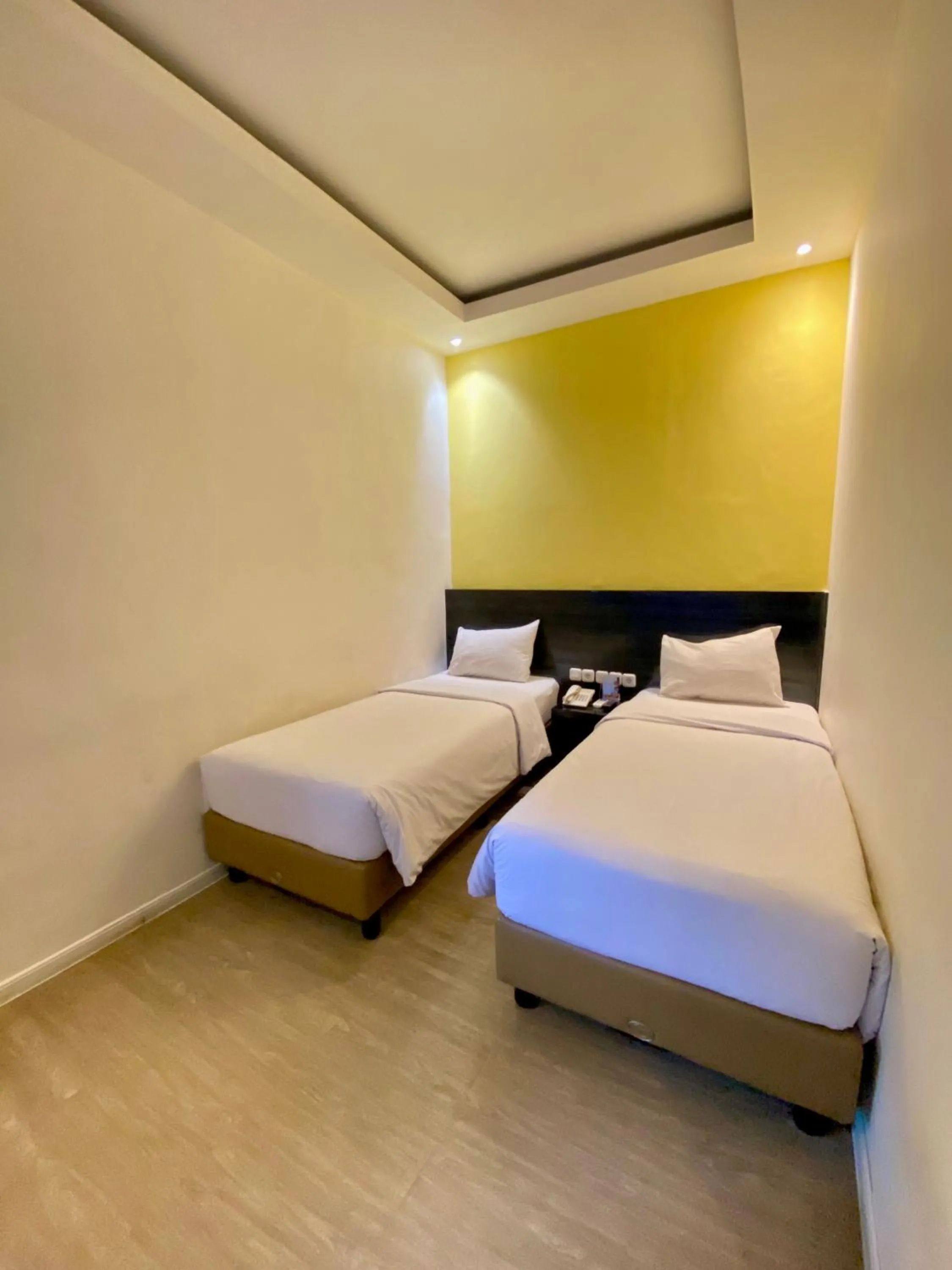 Bed in Rid's Hotel Palembang