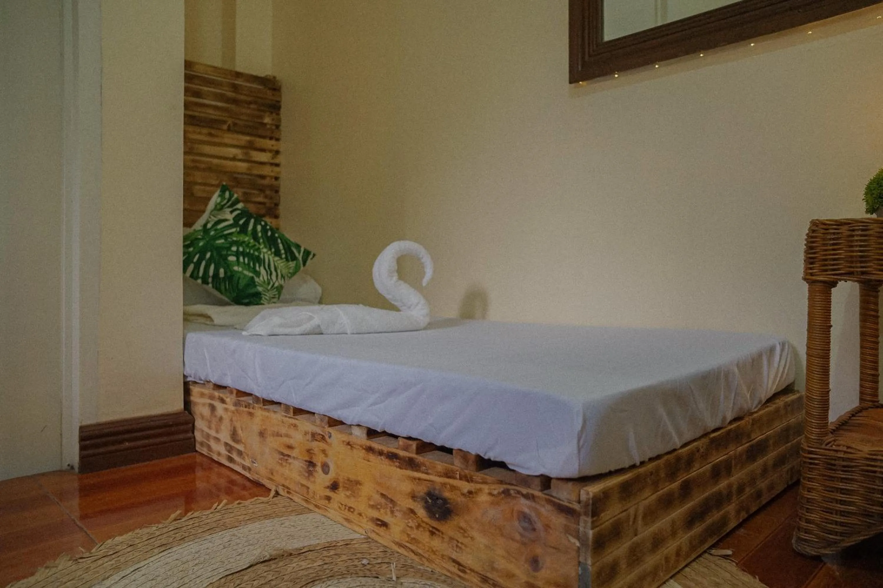 Bed in The Palms Resort & Bar