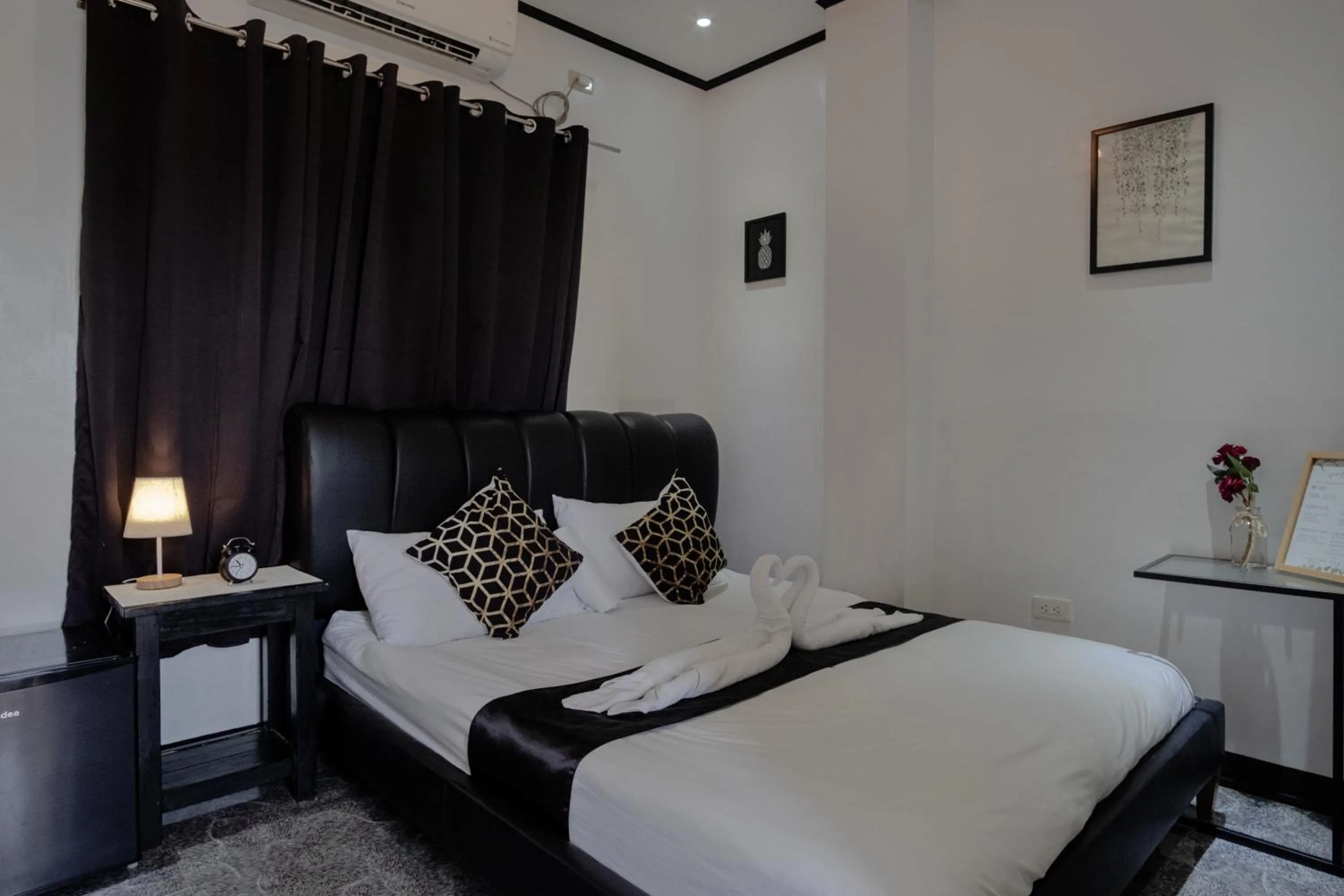 Bed in The Palms Resort & Bar