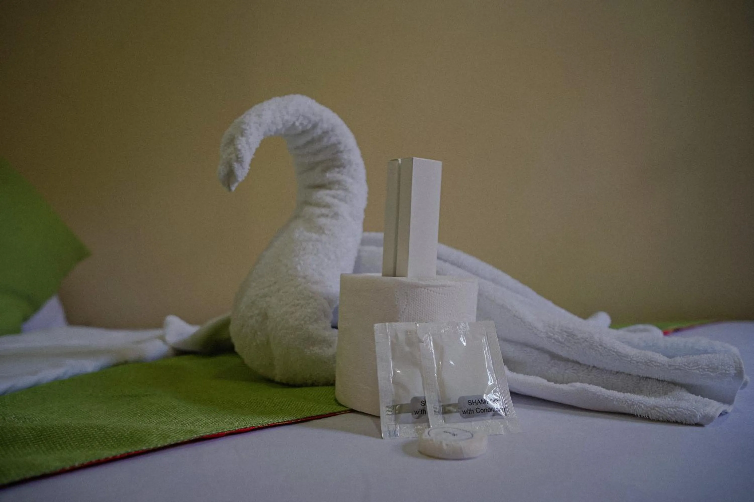 towels, Bed in The Palms Resort & Bar