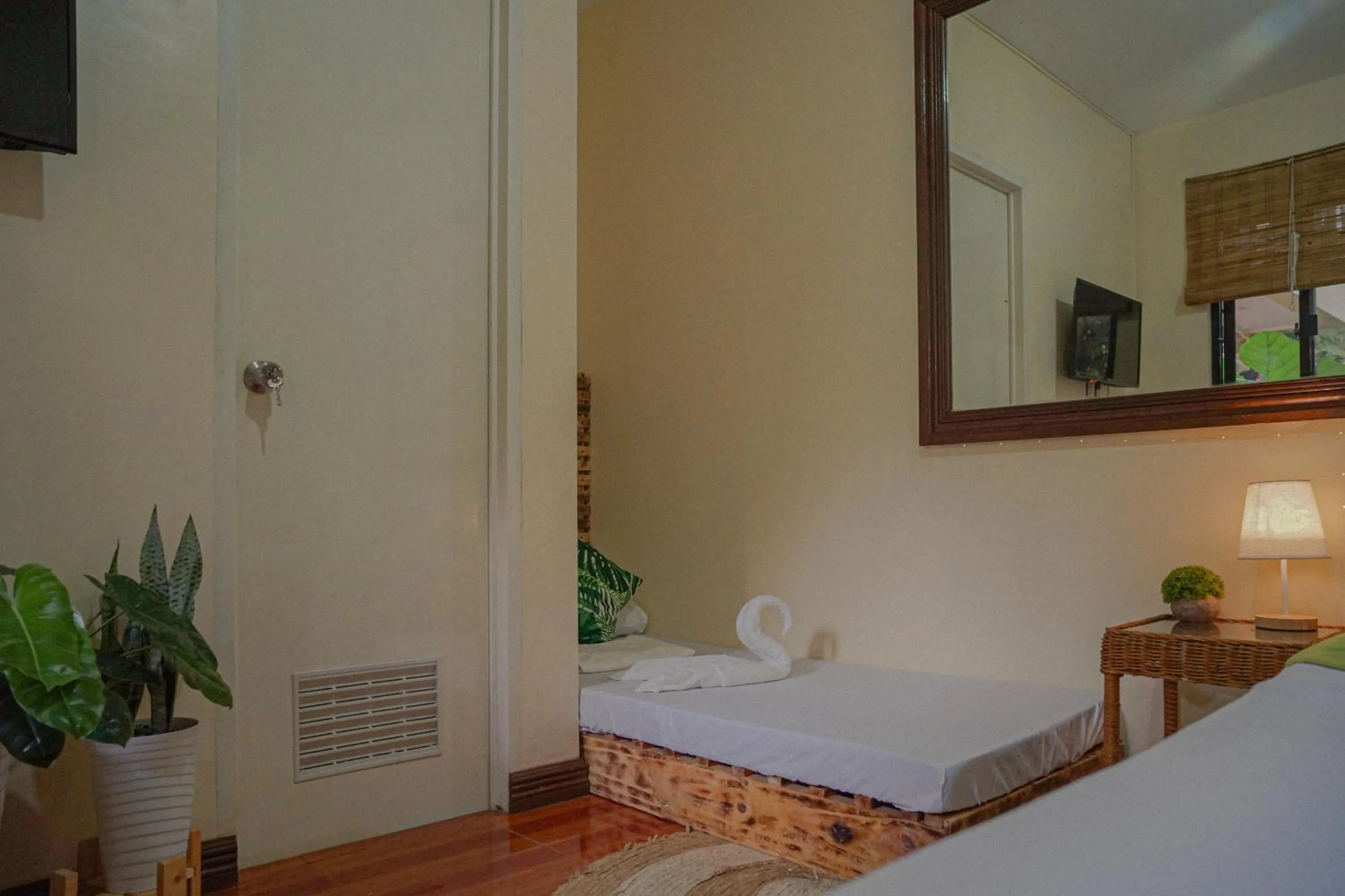 Bed in The Palms Resort & Bar