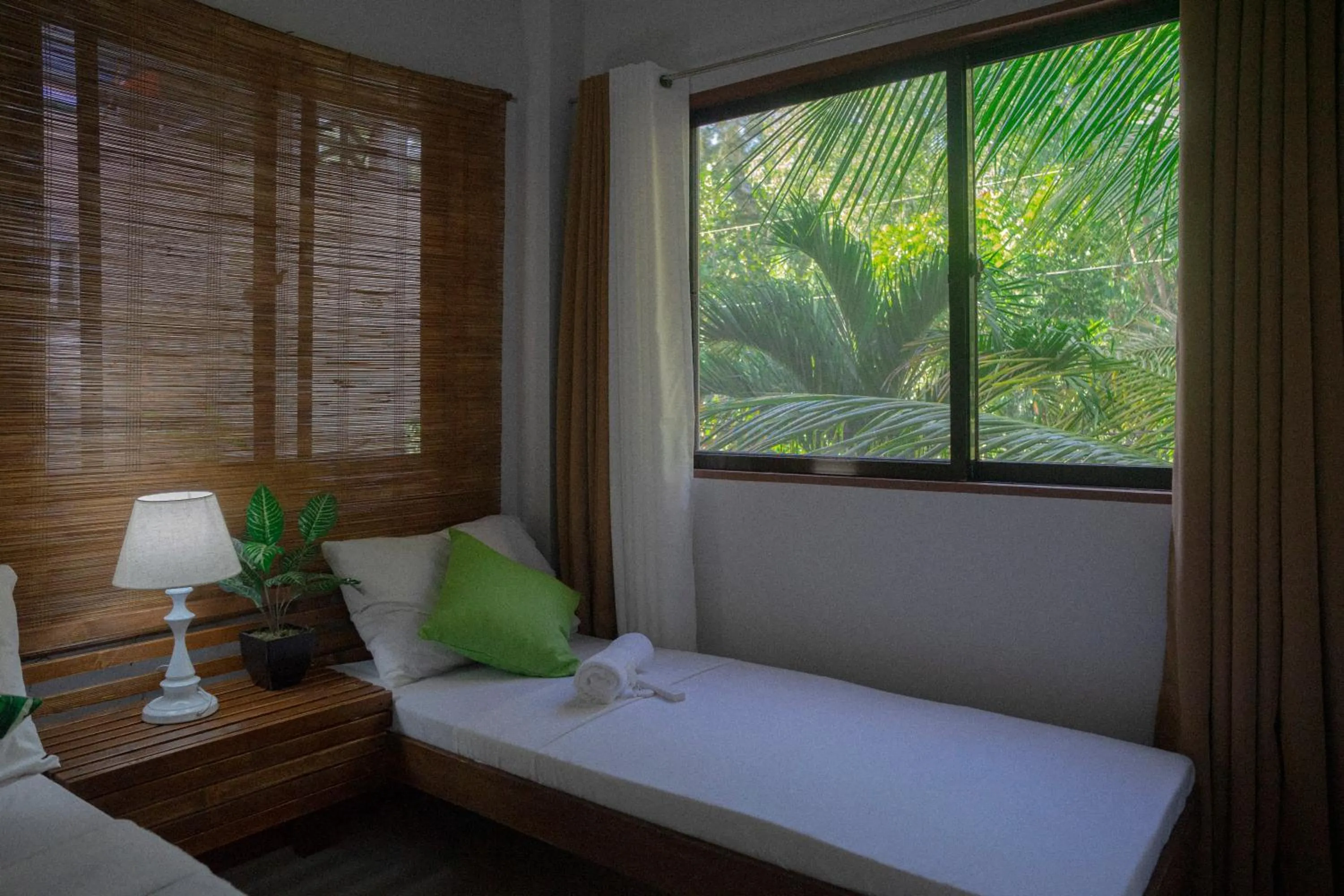 Bed in The Palms Resort & Bar