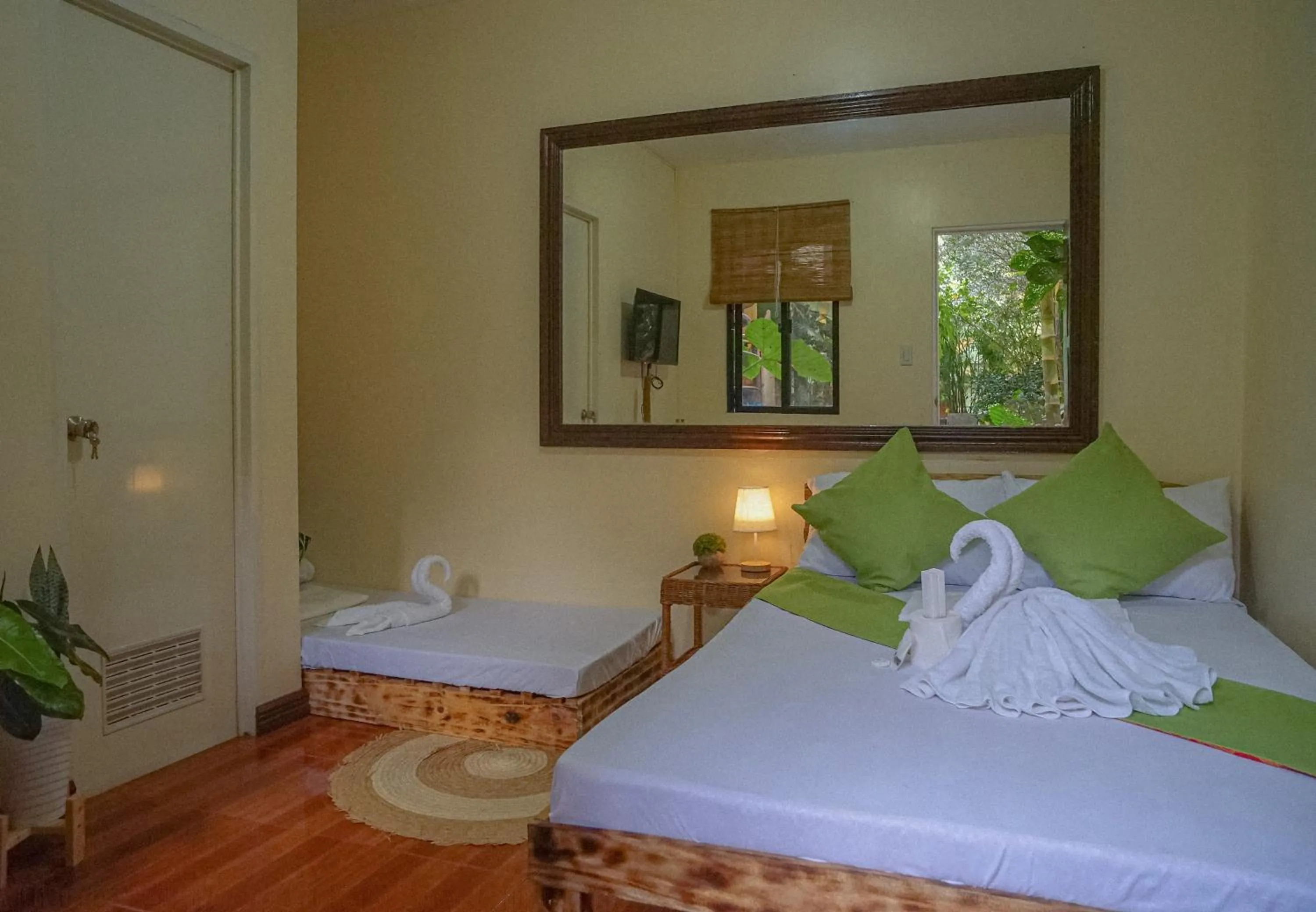 Bed in The Palms Resort & Bar