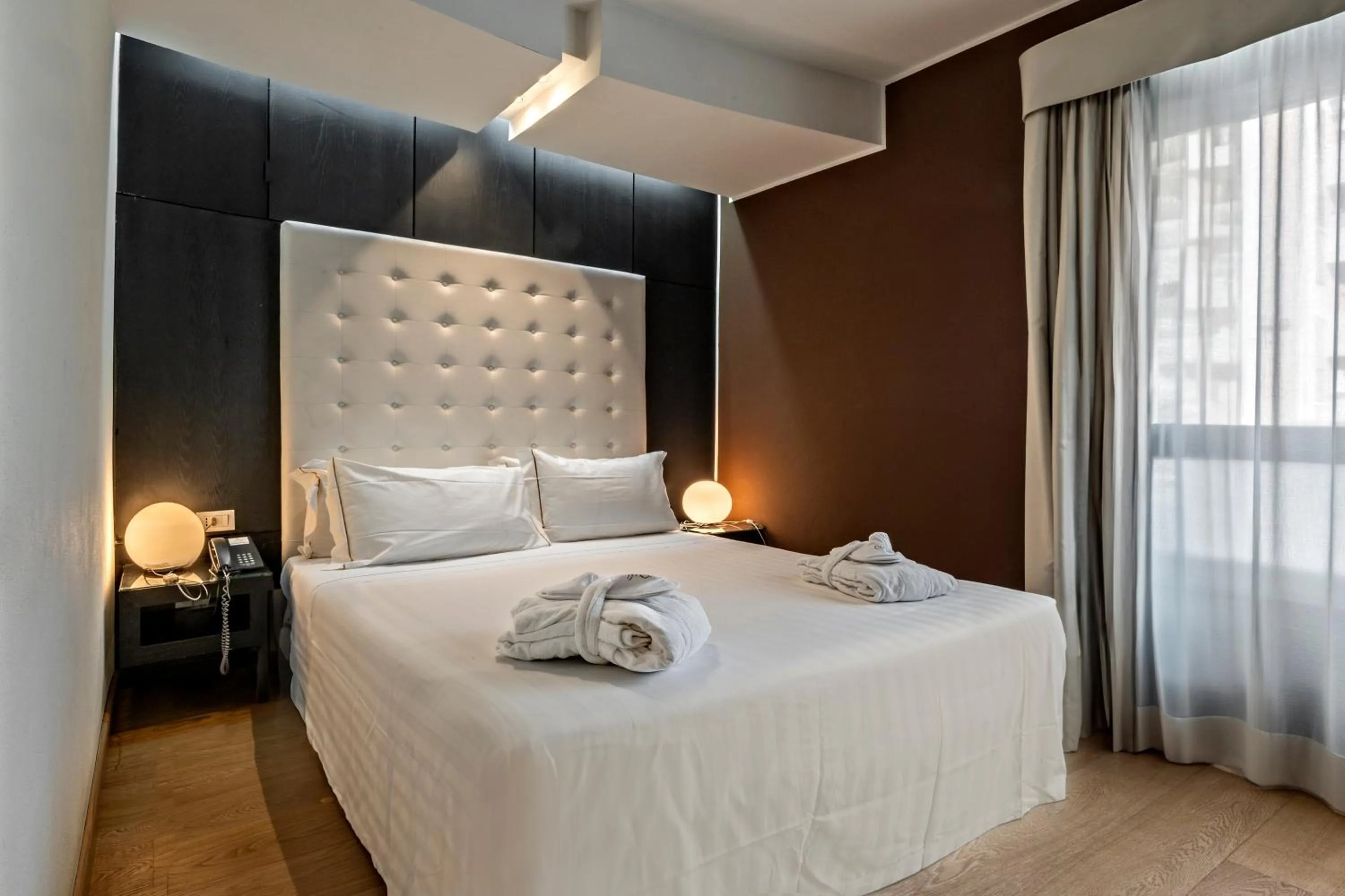 Bed in Sardegna Hotel - Suites & Restaurant
