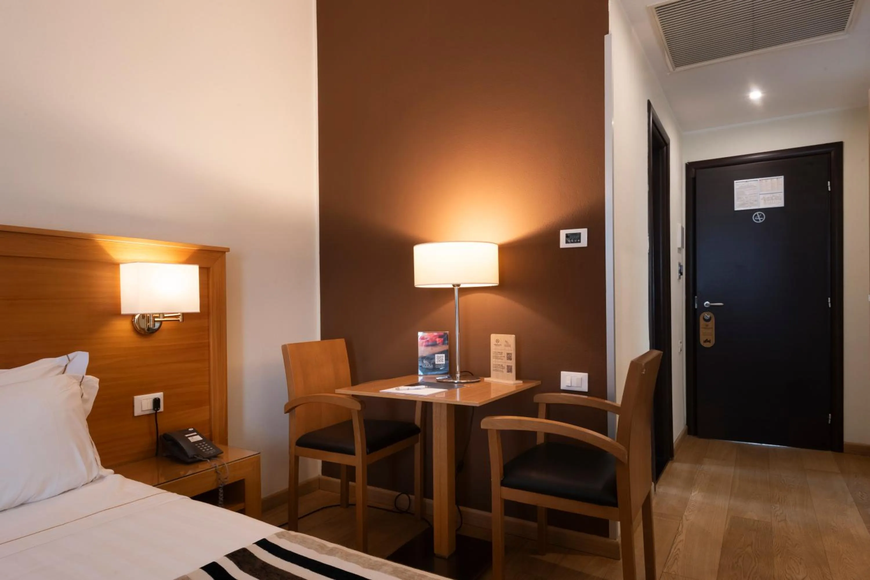 Bed in Sardegna Hotel - Suites & Restaurant