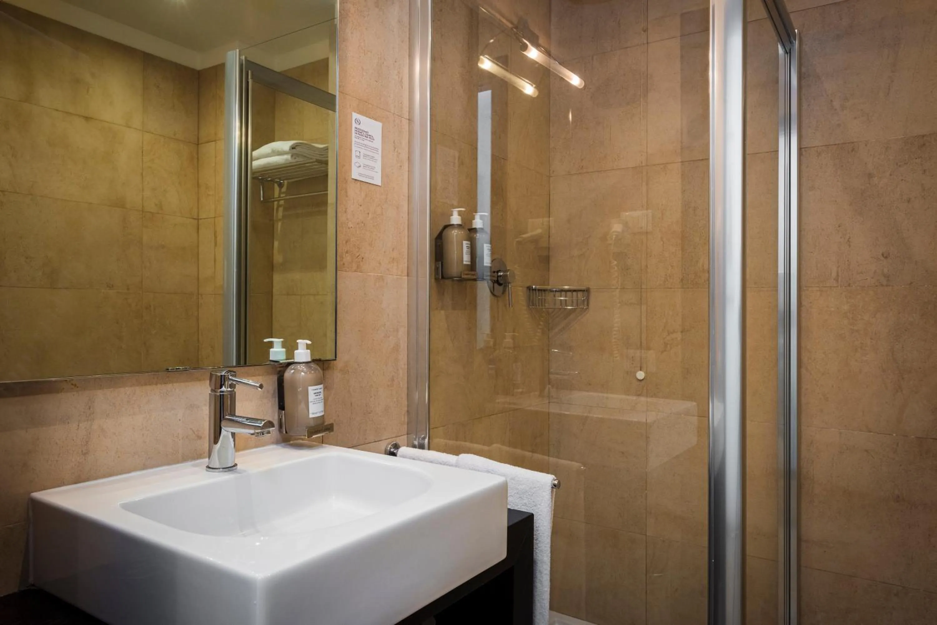 Bathroom in Sardegna Hotel - Suites & Restaurant