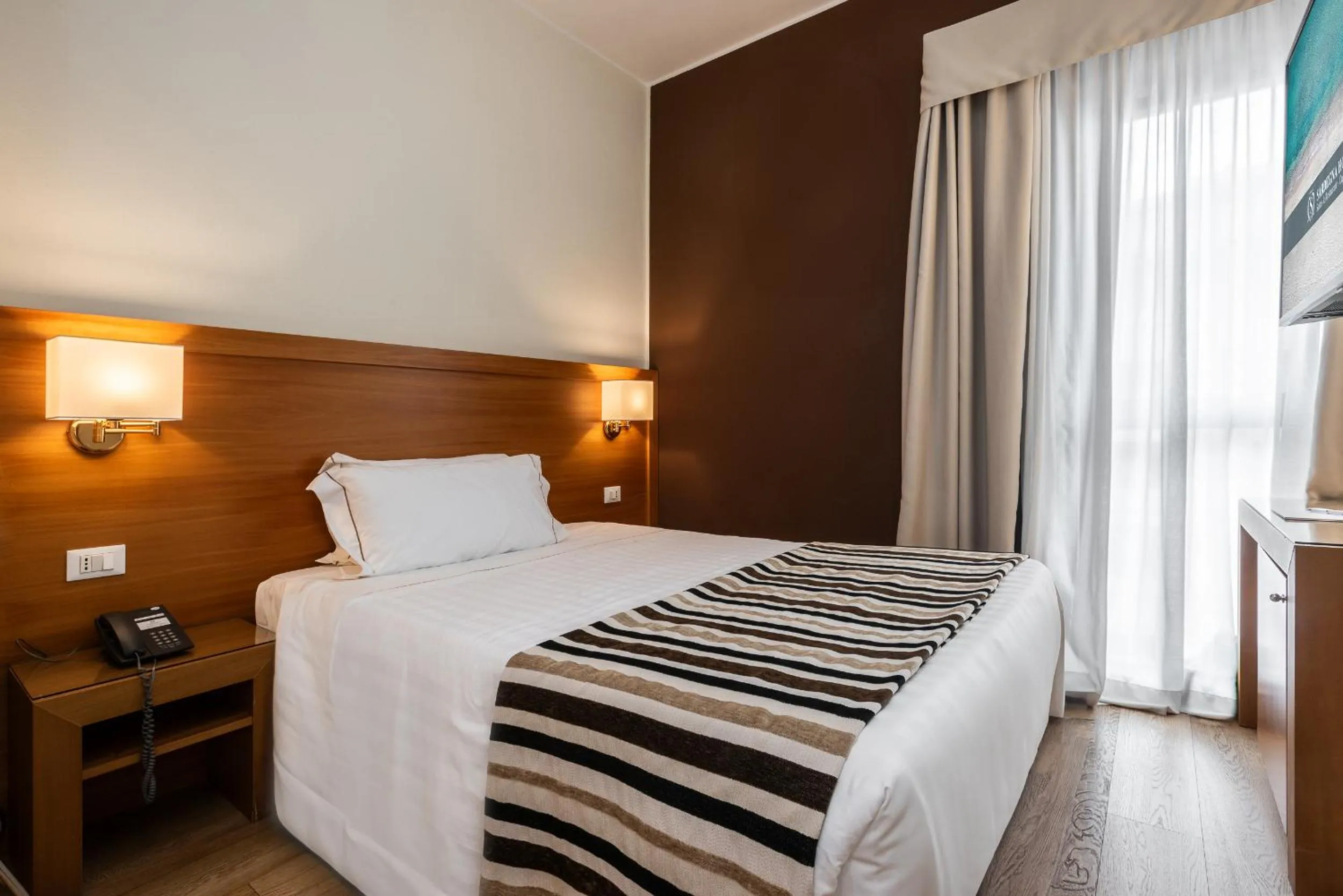 Bed in Sardegna Hotel - Suites & Restaurant