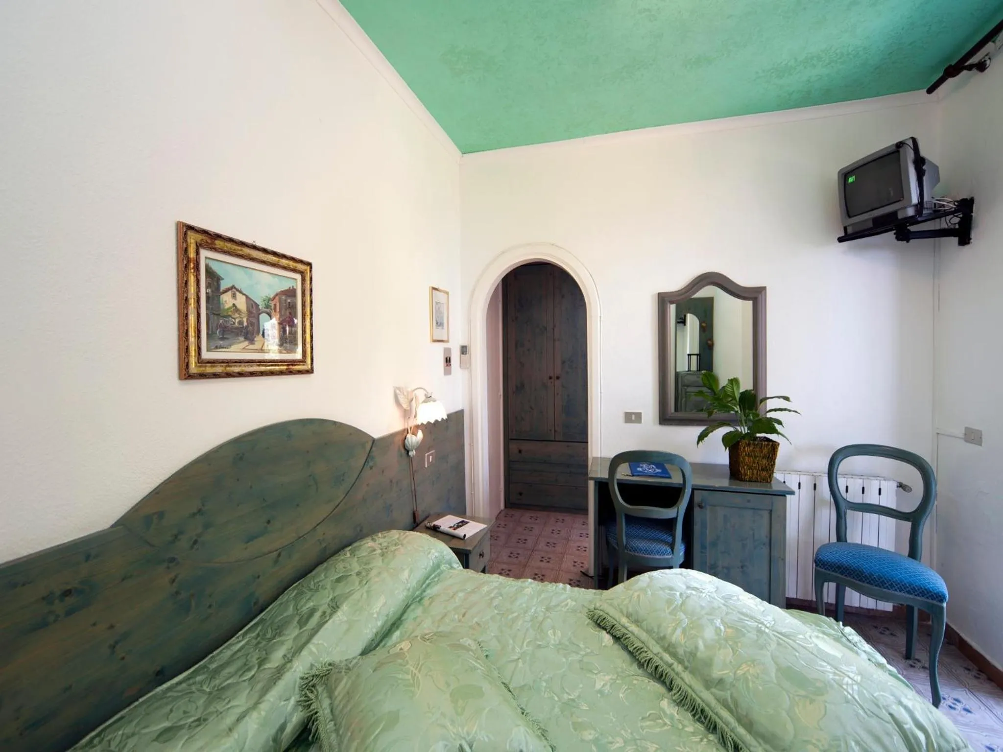 Bed in Hotel Giardino Delle Ninfe E La Fenice