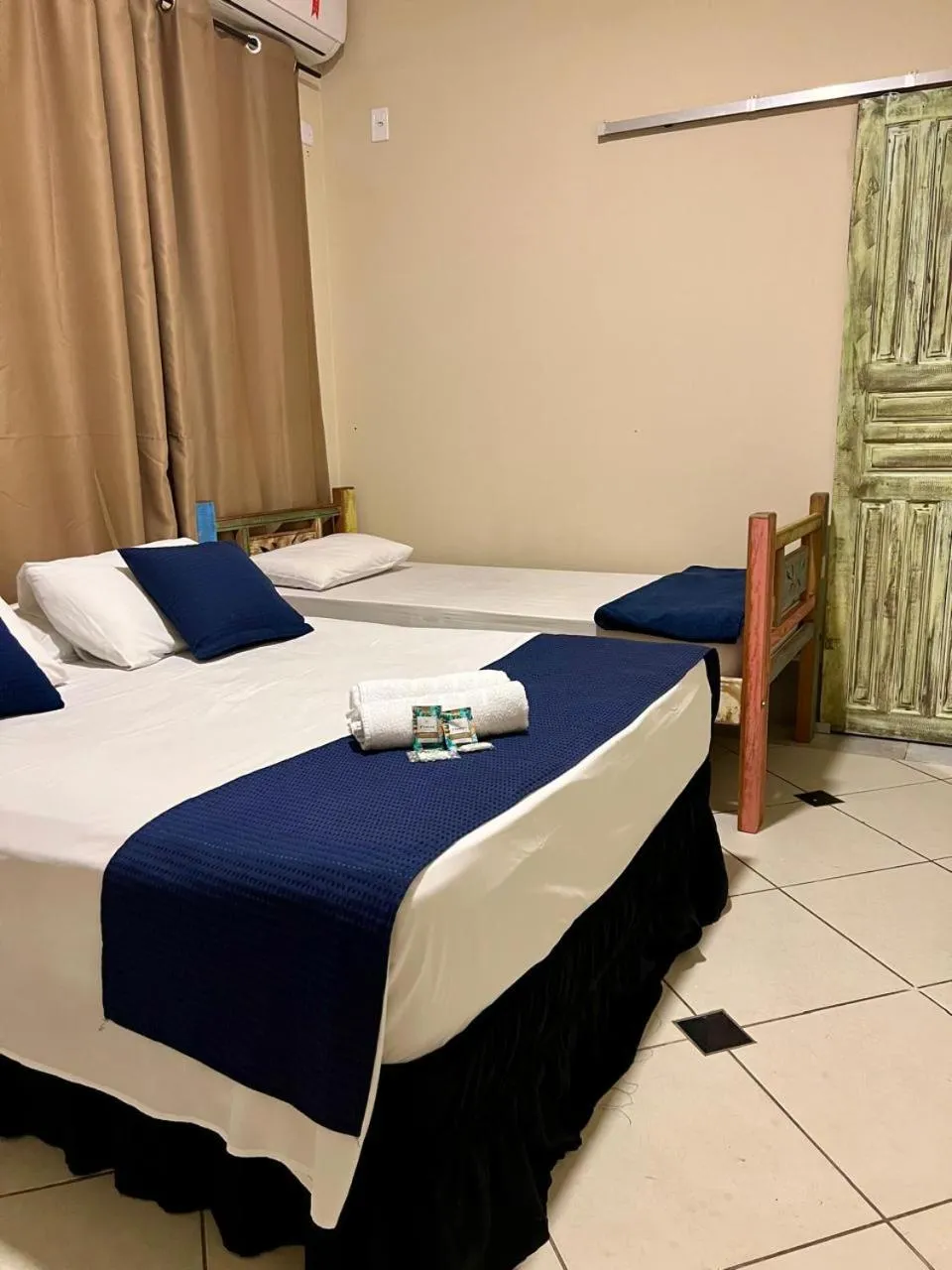 Bed in Pousada Casa Rosada Ilhabela