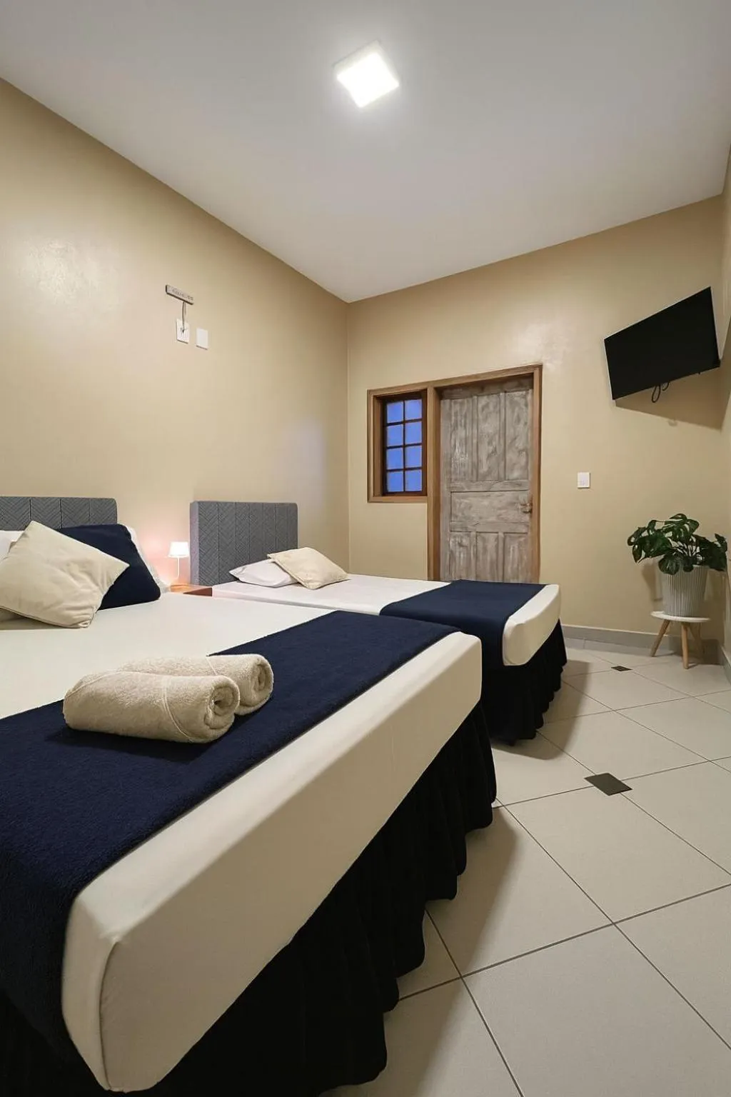 Bed in Pousada Casa Rosada Ilhabela