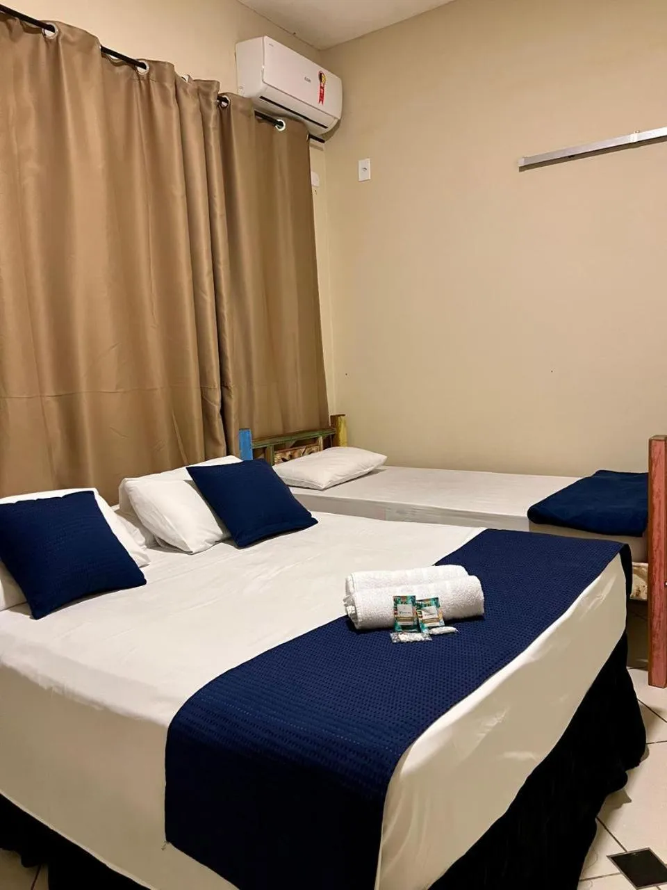 Bed in Pousada Casa Rosada Ilhabela