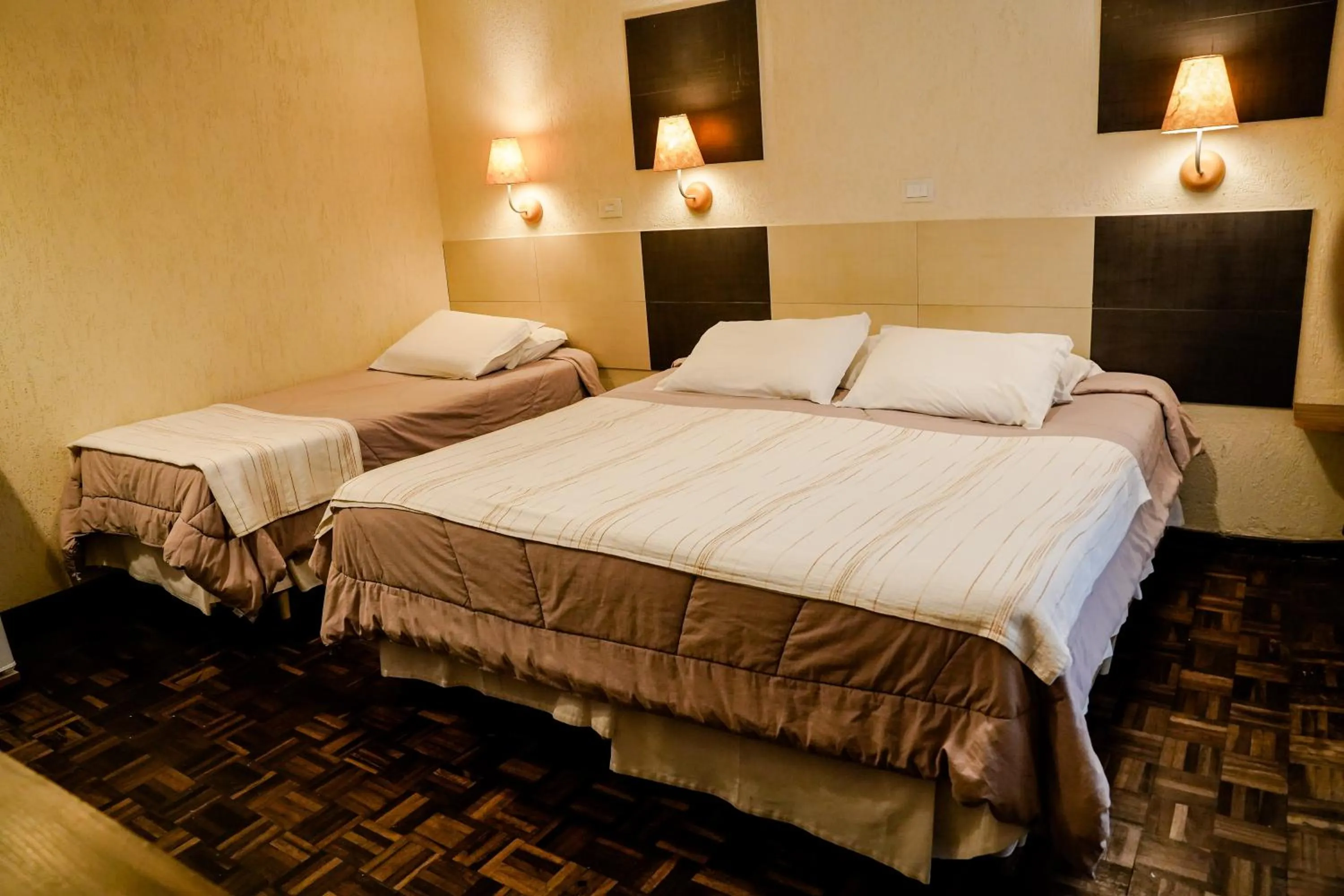 Bed in Pousada do Anhangava