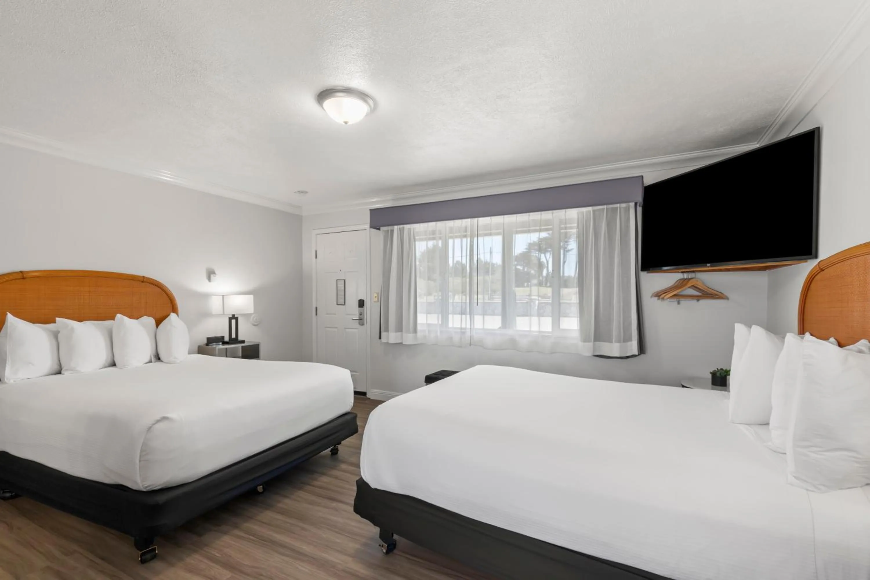 Bed in Beachcomber Motel