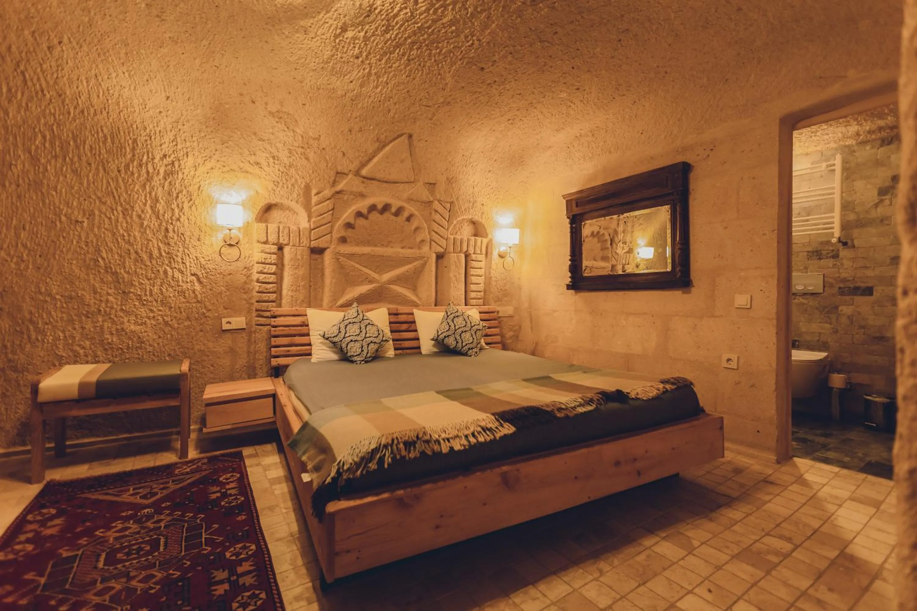Bed in Pinhan Cave Suites
