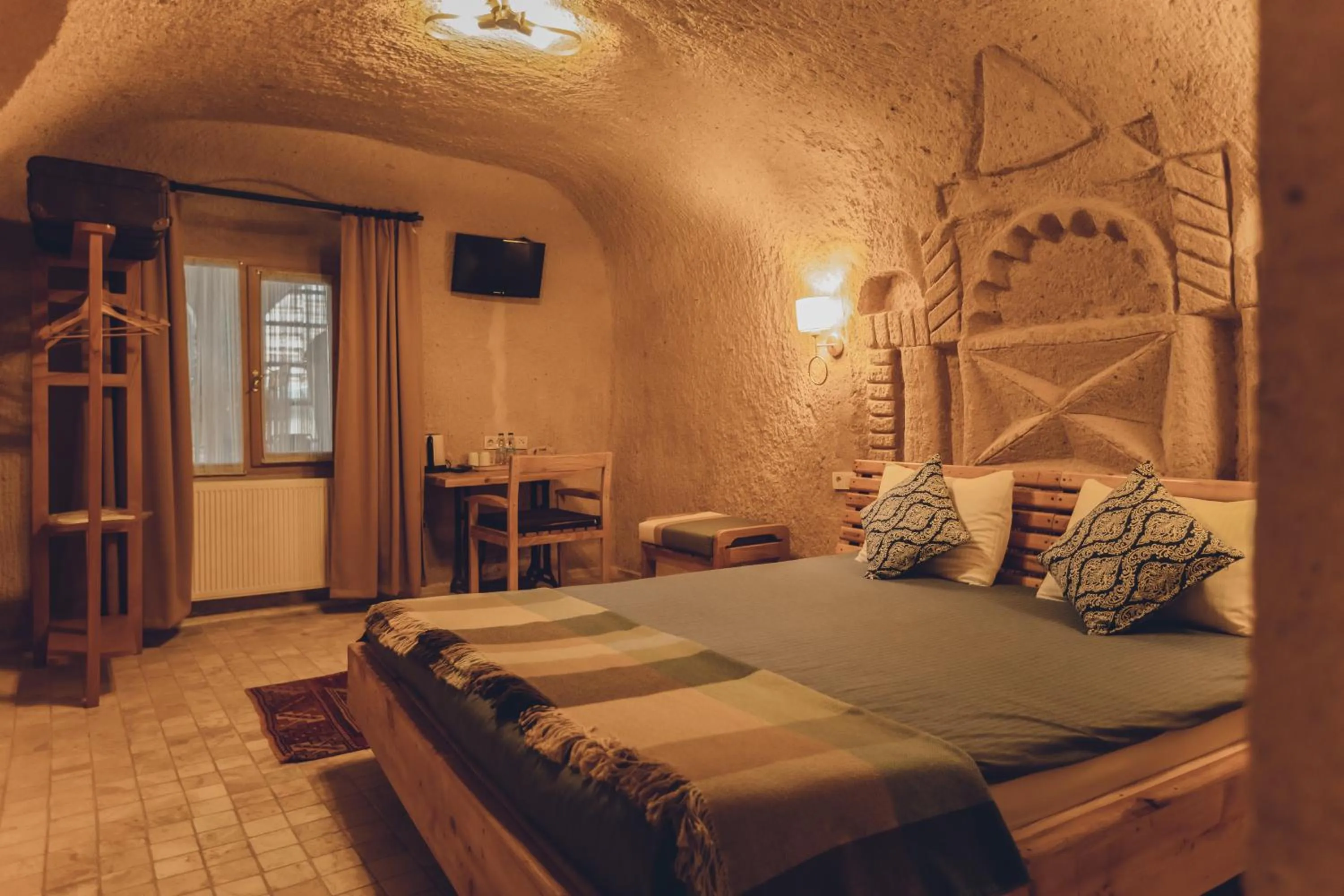 Bed in Pinhan Cave Suites